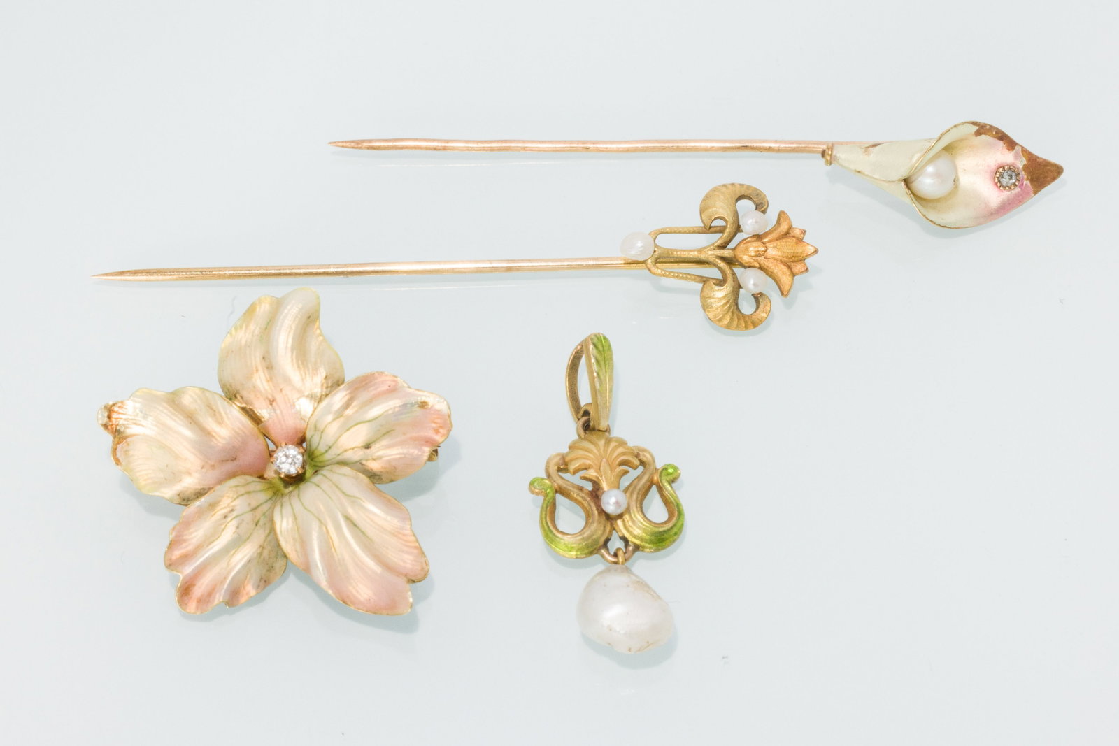 Two 14K Stick Pins, Brooch and a 18K Pendant: Property from a Private Collection, Jacksonville, FL Description: Two 14K Stick Pins, Brooch and a 18K Pendant, comprising a 14K gold stick pin with seed pearls (marked '14K'), a 14K and enamel fl