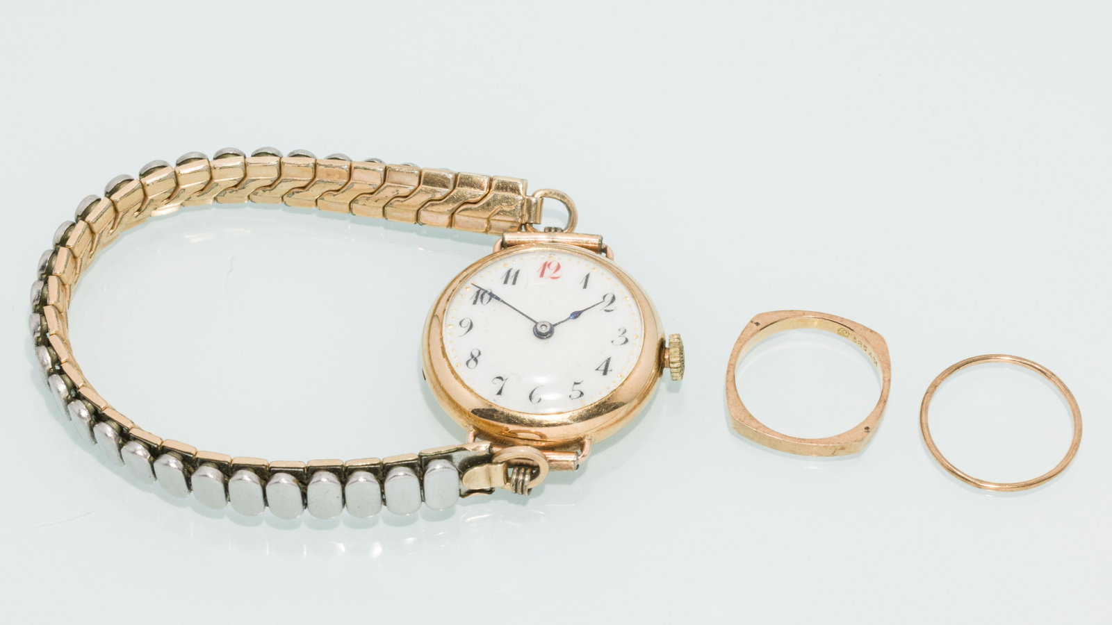 Vintage Swiss Watch, 14K Ring and 10K Band: Description: Vintage Swiss Watch, 14K Ring and 10K Band , comprising a 14K yellow gold Swiss watch with white dial and Arabic numerals, monogrammed on back on an expandable band marked 'DREMA, 20