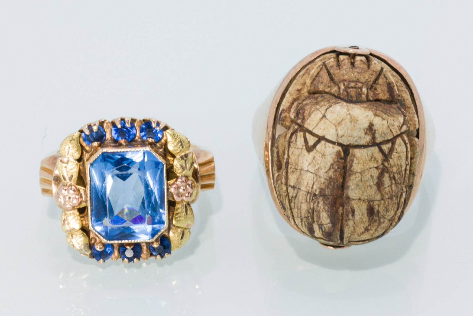 Two 10K Vintage Rings, One with Scarab: Description: Two 10K Vintage Rings, One with Scarab, comprising a 10K yellow and rose gold ring with synthetic blue faceted stones, size 5.25 (marked '10K, P.S.CO') and a 10K gold ring with spinn