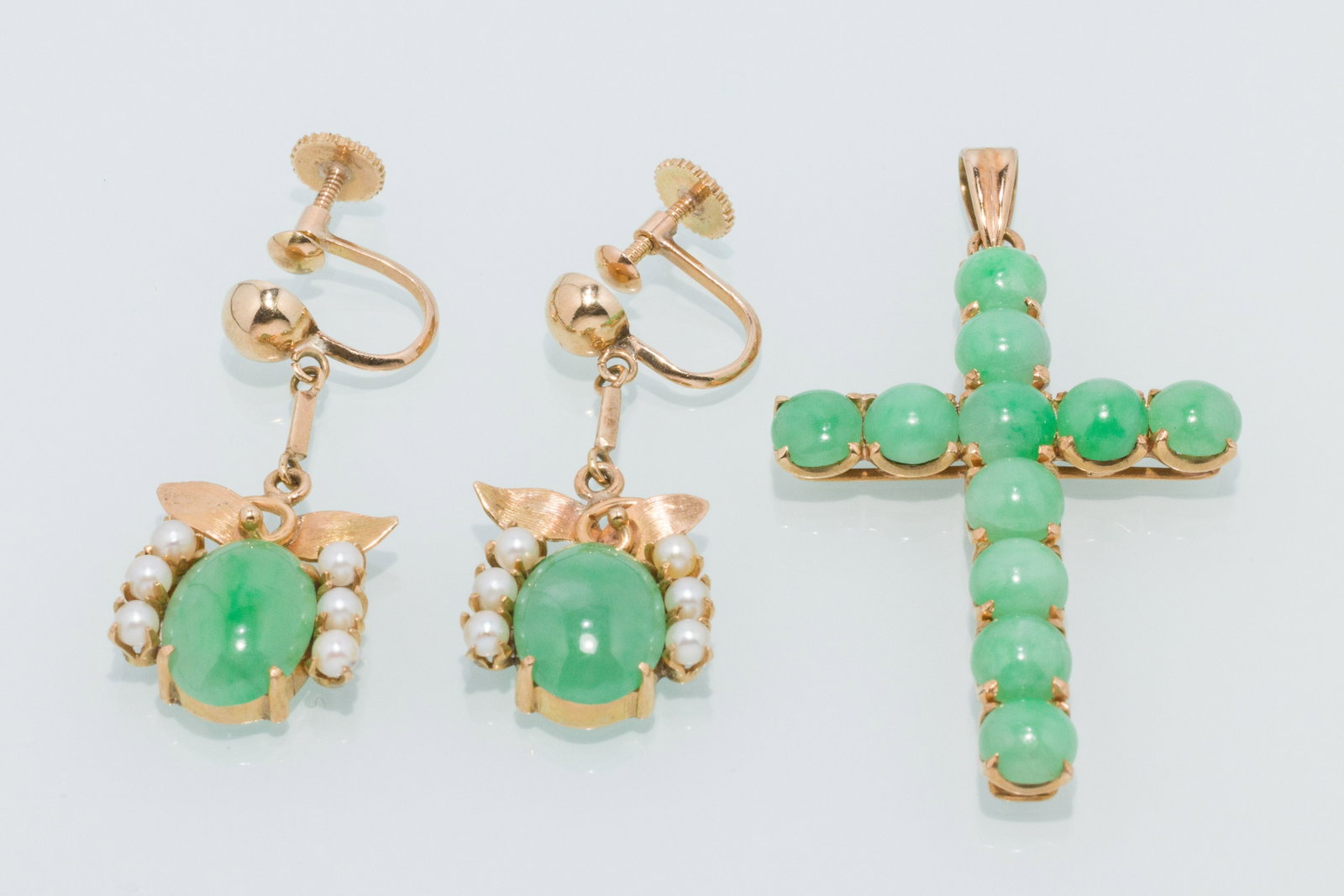 Jade and 14K Gold Earrings and a Cross Pendant: Property from a Private Collection, Jacksonville, FL Description: Jade and 14K Gold Earrings and a Cross Pendant, in 14K yellow gold, the jade and pearl earrings with screw backs, measuring 1.25 i