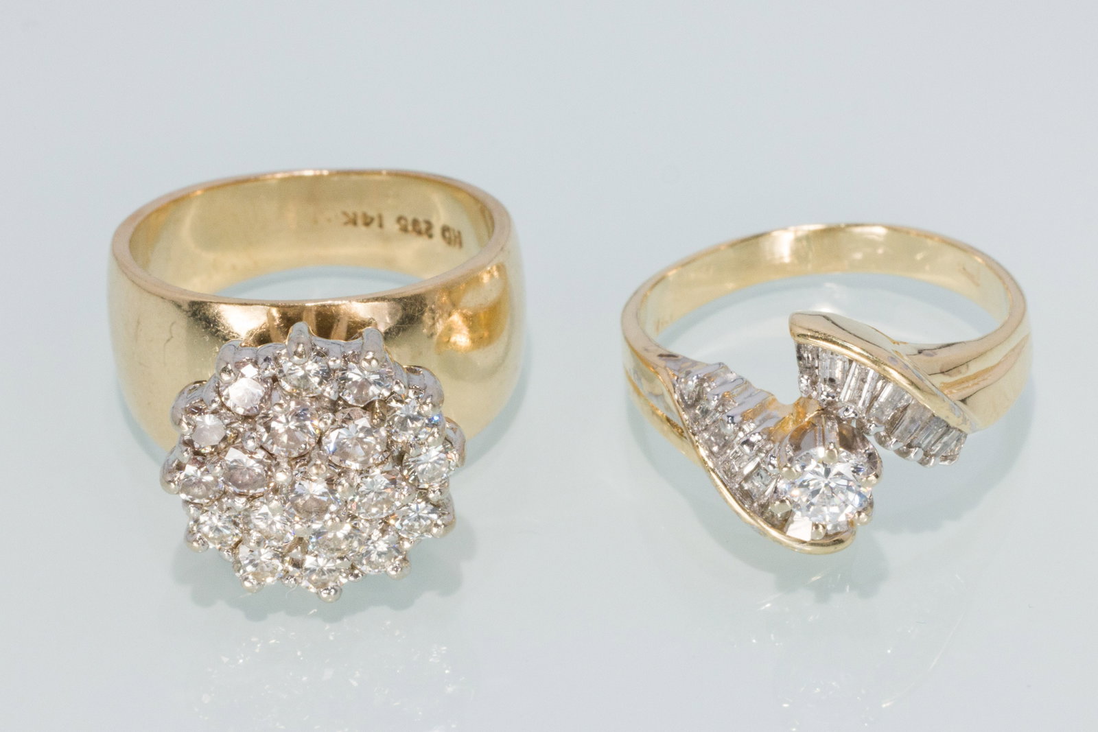 Two Ladies Diamond Rings in 14K: Property from a Private Collection, Jacksonville, FL Description: Two Ladies Diamond Rings in 14K, in 14K yellow gold, one featuring a cluster of full cut round diamonds, hallmarked 'HD, 295, 14K'