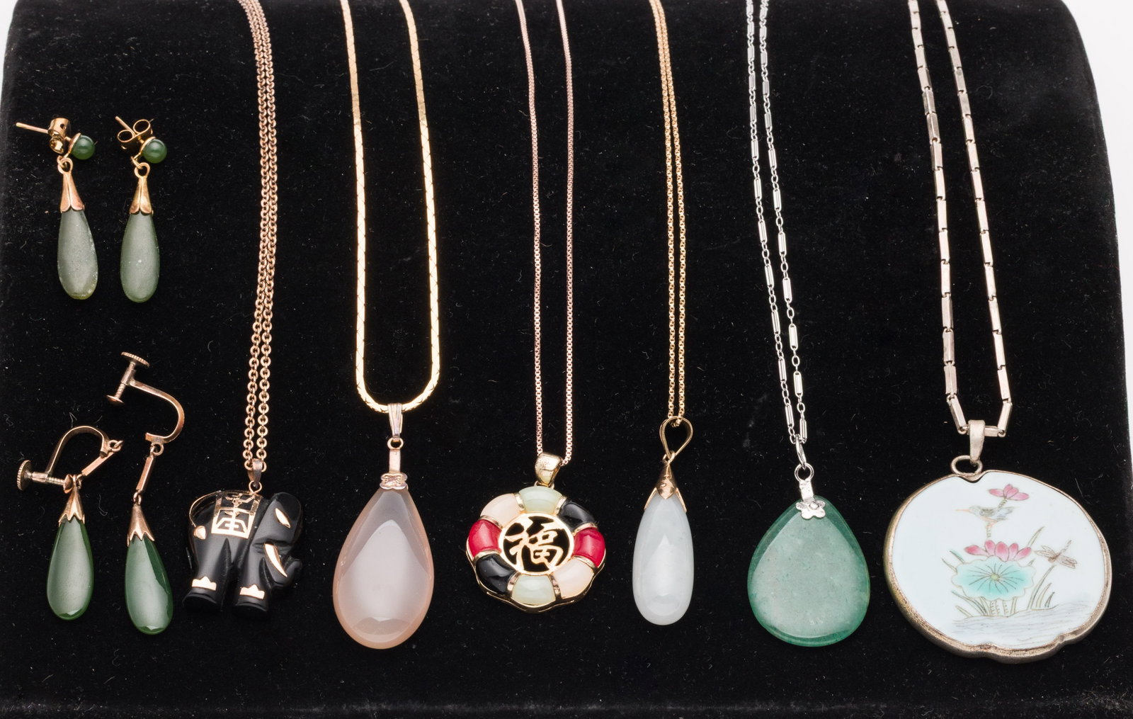 Group of Jade and Gold Jewelry: Property from a Private Collection, Jacksonville, FL Description: Group of Jade and Gold Jewelry , comprising a 10 in. necklace with a gilt sterling chain (marked on clasp) and a central Chinese s