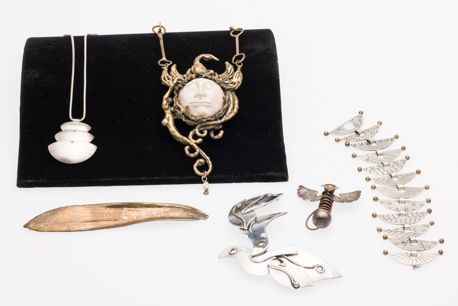 Group of Artisan Jewelry, 7 pcs.: Description: Group of Artisan Jewelry Including Mignon Faget & TM Design, 7 pcs., comprising a 12 1/2 in. necklace with a sterling silver pendant signed and marked on the back with in a half sphe