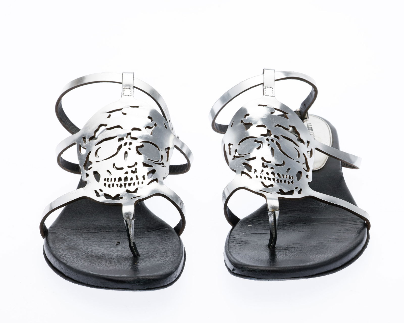 Alexander McQueen Silver Leather Scull Sandals: Description: Alexander McQueen Silver Leather Scull Sandals , Alexander McQueen laser cut skull silver-tone leather sandals size 8 (38) with dust bag and shoe box. Measurements: