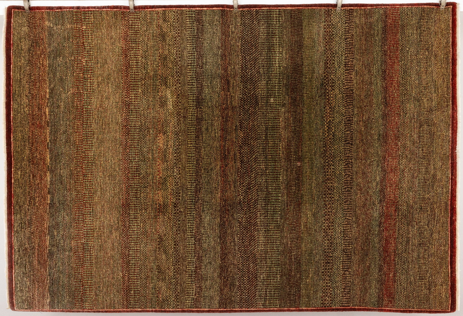 Contemporary Indian Wool Rug by Mahindra: Property from the Estate of Arthur B. Kouwenhoven Jr., Savannah, GADescription: Contemporary Indian Wool Rug by Mahindra, striated rug in tones of blue, green, and grey on a maroon