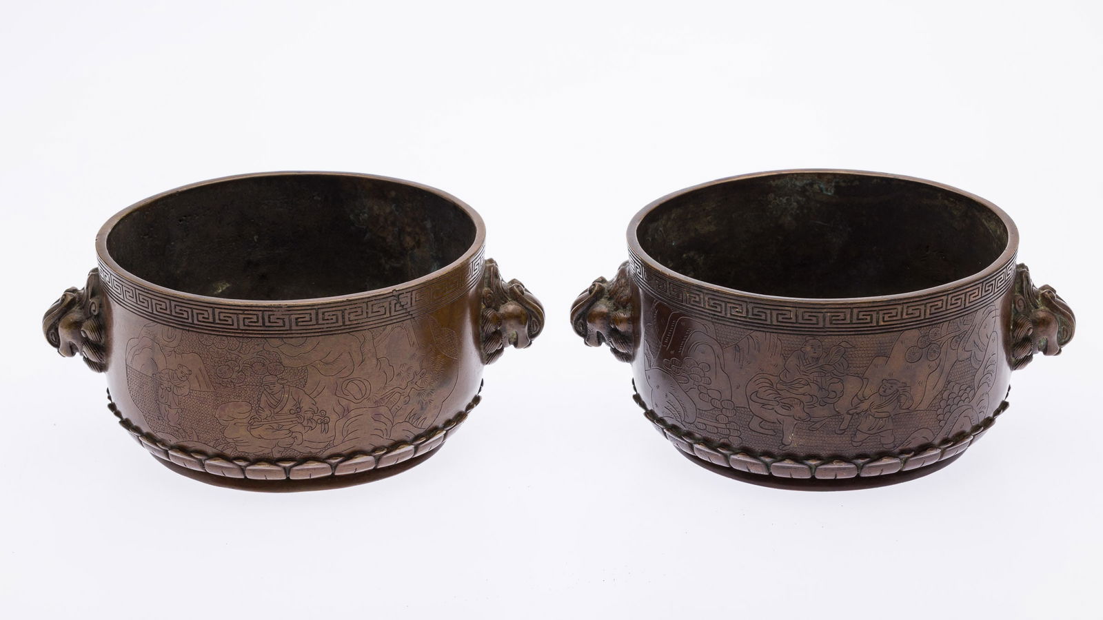 Pair of Chinese Bronze Censers with Foo Dog Handles: Property from the Estate of Arthur B. Kouwenhoven Jr., Savannah, GADescription: Pair of Chinese Bronze Censers with Foo Dog Handles, each with foo dog- form handles and decorated with chinoiserie