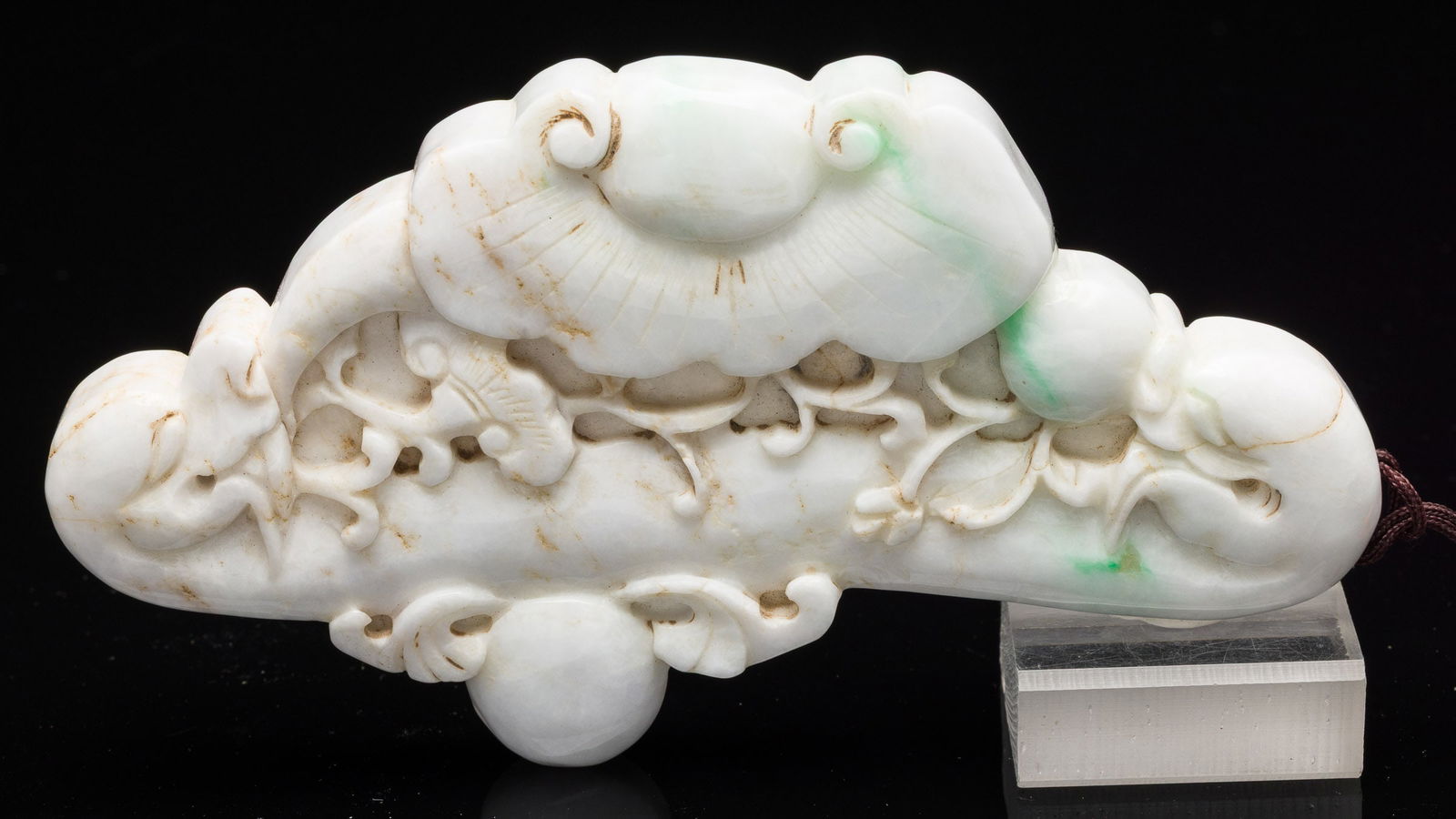 White Jadeite Pendant Carved with Dragons and Lotus: Property from the Estate of Arthur B. Kouwenhoven Jr., Savannah, GA Description: White Jadeite Pendant Carved with Dragons and Lotus, double sided pendant carved with dragon and lotus motif, on a