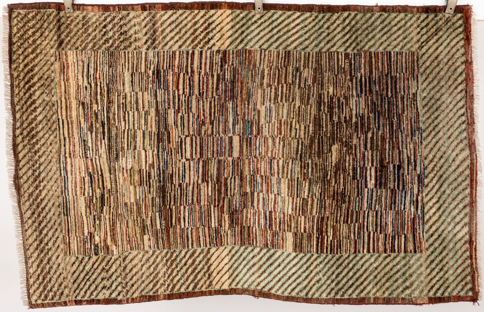 Modern Wool Rug: Property from the Estate of Arthur B. Kouwenhoven Jr., Savannah, GADescription: Modern Wool Rug, with variegated patterning in tones of grey, brown, and cream on a maroon ground.Measurements: Length: