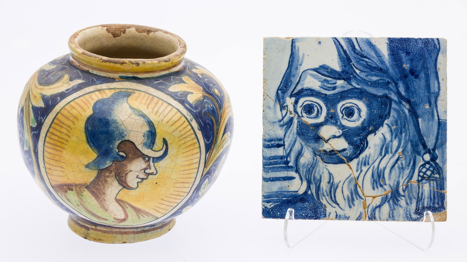 Italian Ceramic Vase and a Monkey Tile: Property from the Estate of Arthur B. Kouwenhoven Jr., Savannah, GADescription: Italian Ceramic Vase and a Monkey Tile, a yellow and blue glazed vase decorated with busts of soldiers and floral