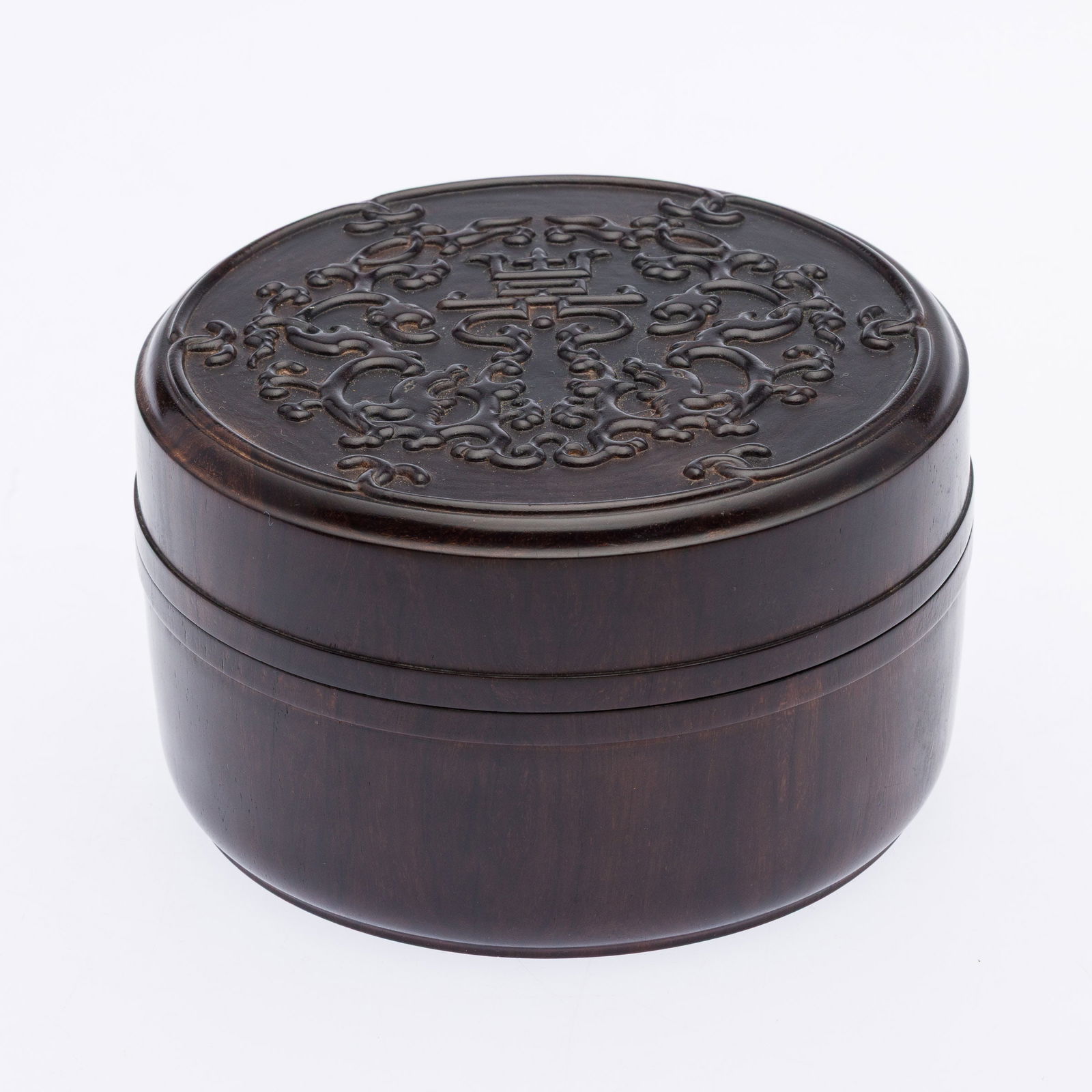 Chinese Carved Wood Box: Property from the Estate of Arthur B. Kouwenhoven Jr., Savannah, GA Description: Chinese Carved Wood Box, round box with dragon and character design on lid, in a fitted silk box. Dimensions of fit