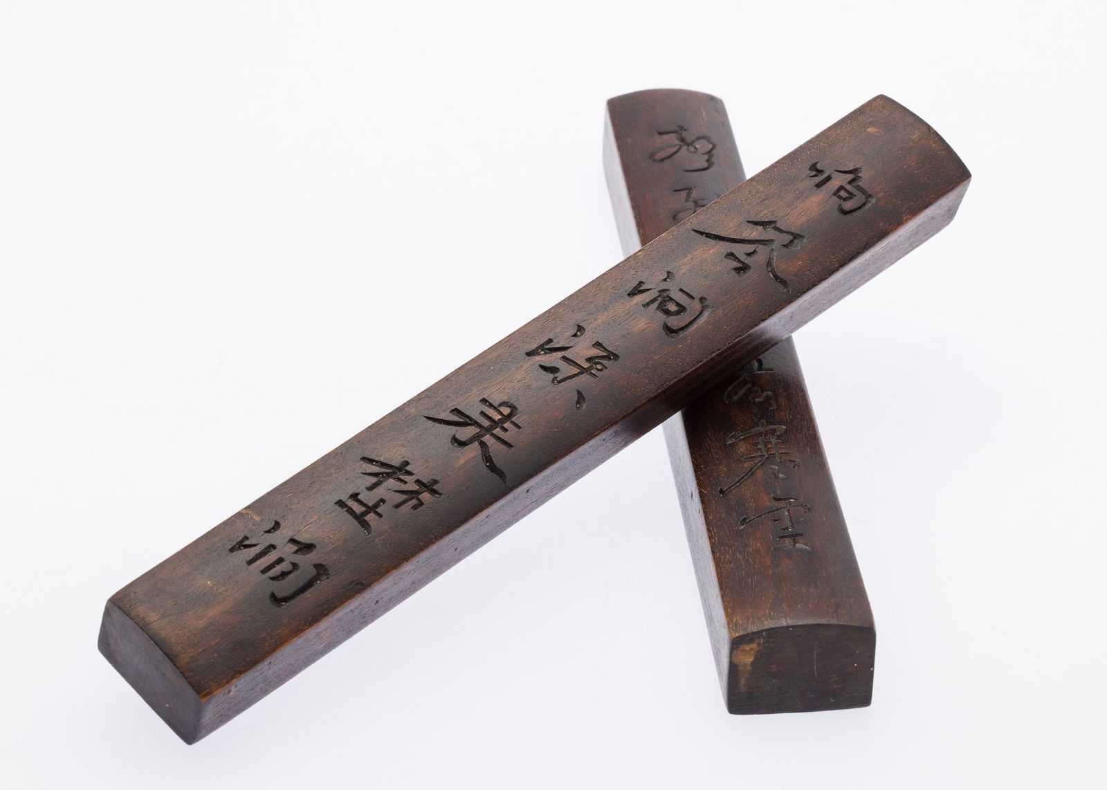 Pair of Chinese Hardwood Scroll Rests: Property from the Estate of Arthur B. Kouwenhoven Jr., Savannah, GADescription: Pair of Chinese Hardwood Scroll Rests, each decorated with characters.Measurements: Height: 10 1/2 in. x Width: 1 1/2