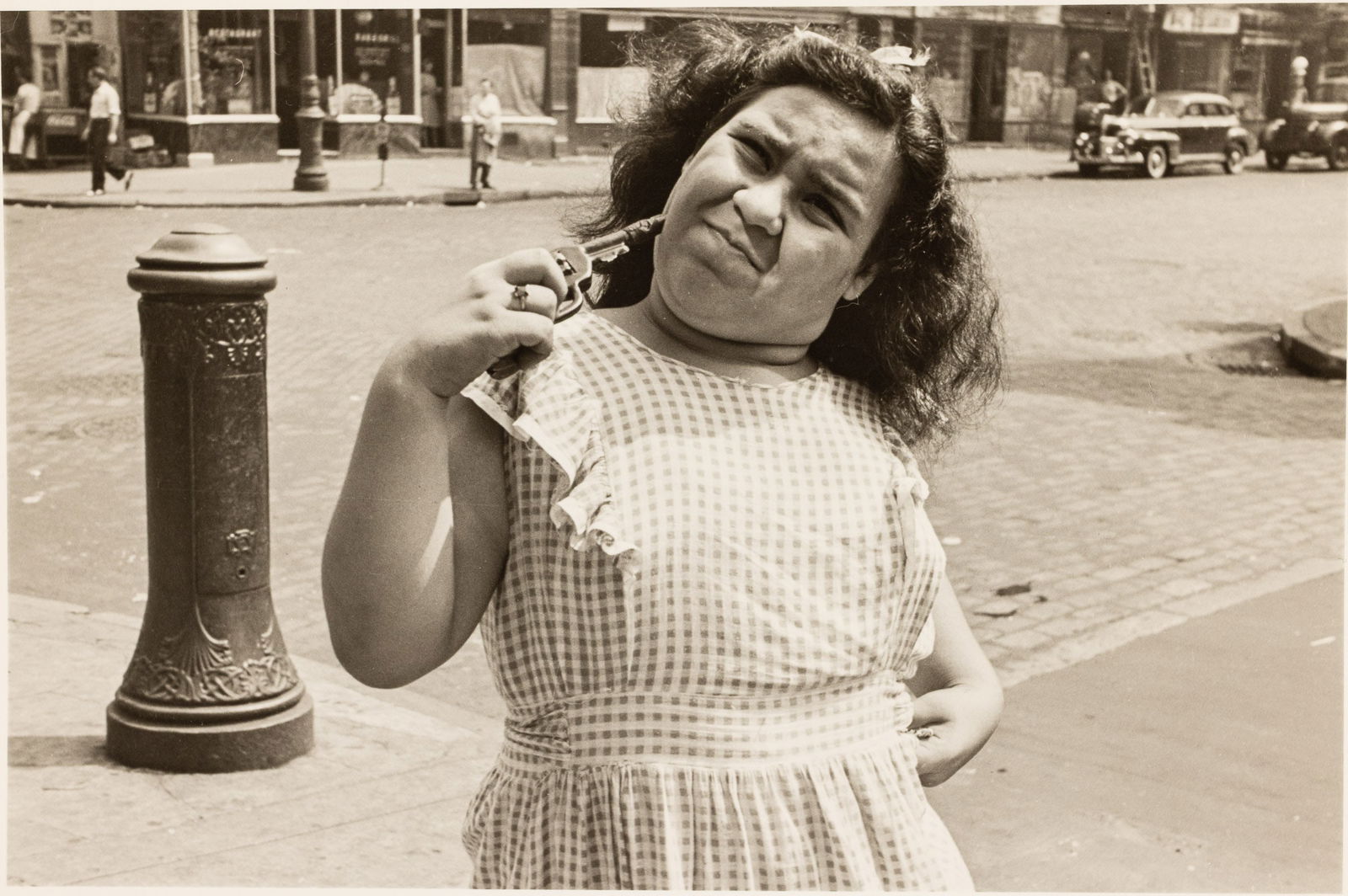 Helen Levitt, Untitled (Girl with Gun), 1940: Property of Barron Rachman, SC and NYDescription: Helen Levitt (1913-2009), Untitled (Girl with Gun), Silver Gelatin, 1940, pencil signed and dated 'N.Y., c. 1940' and '54A', printed by Chuck Kelton