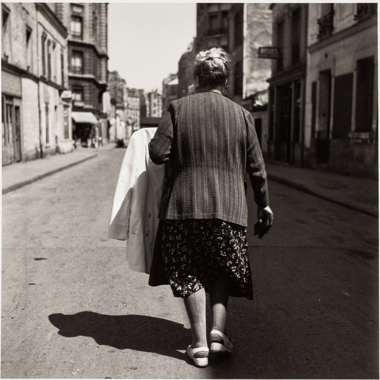 Louis Stettner, Paris 1950 (Woman walking on a road) (1 of 9)