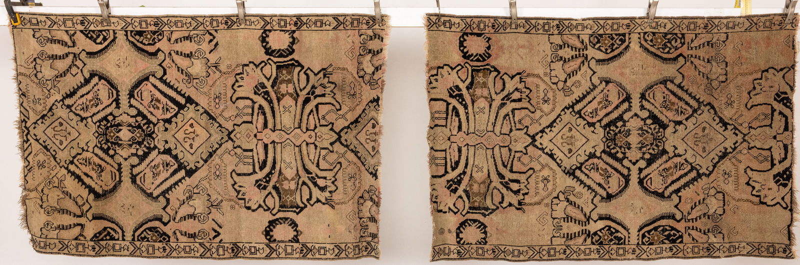 Two Antique Persian Rug Fragments: Property from a Private Collector, Savannah, GA Description: Two Antique Persian Rug Fragments, in tones of dark blue and pink on a tan ground, probably formerly a runner, each with tabs on verso