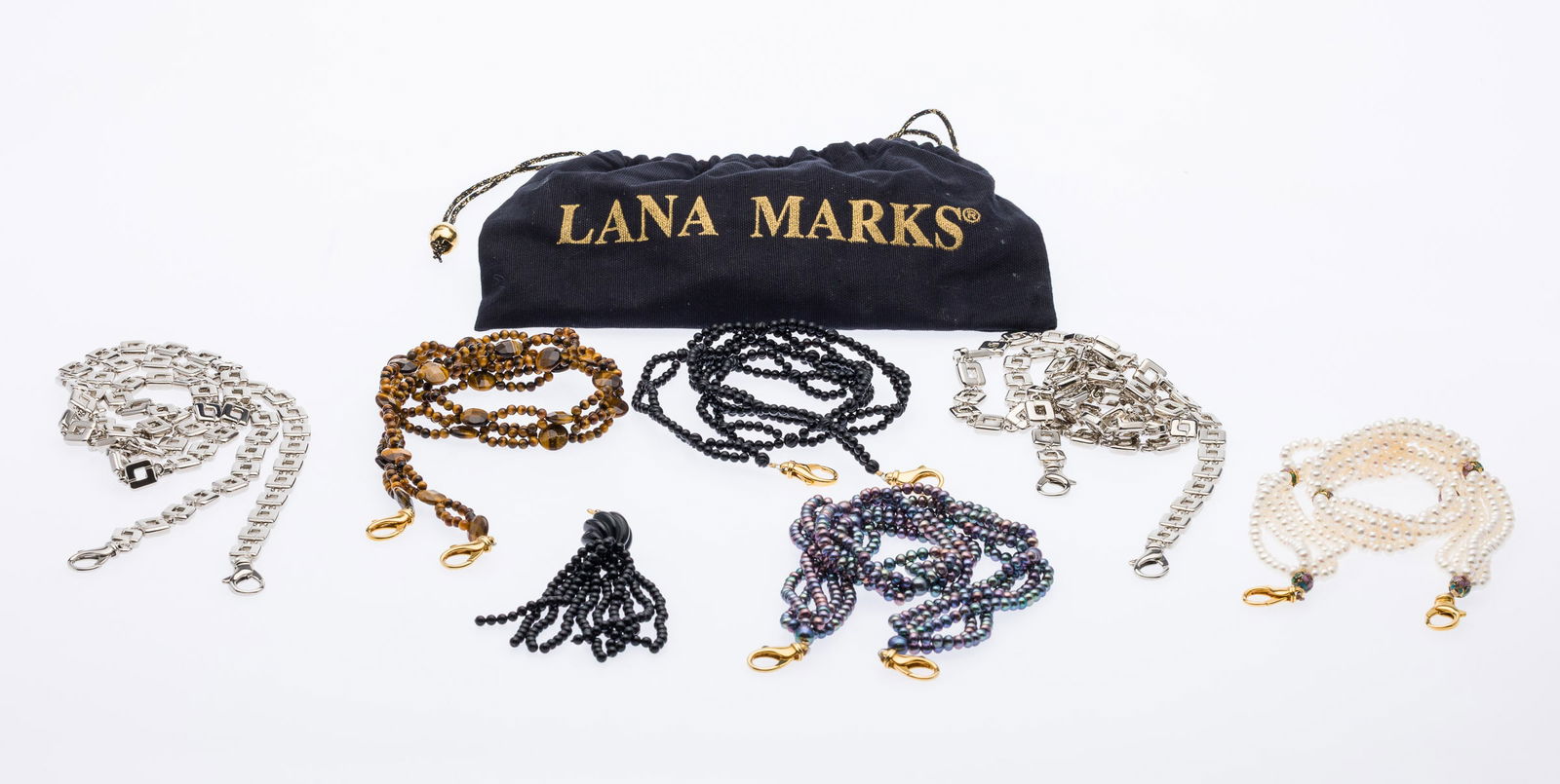 6 Lana Marks Straps and a Tassel: Property from a Private Collection, St. Simons Island, GADescription: 6 Lana Marks Straps and a Tassel, comprising a 21 1/2 in. beaded black pearl multistrand strap, a 36 1/2 in. beaded tigers eye