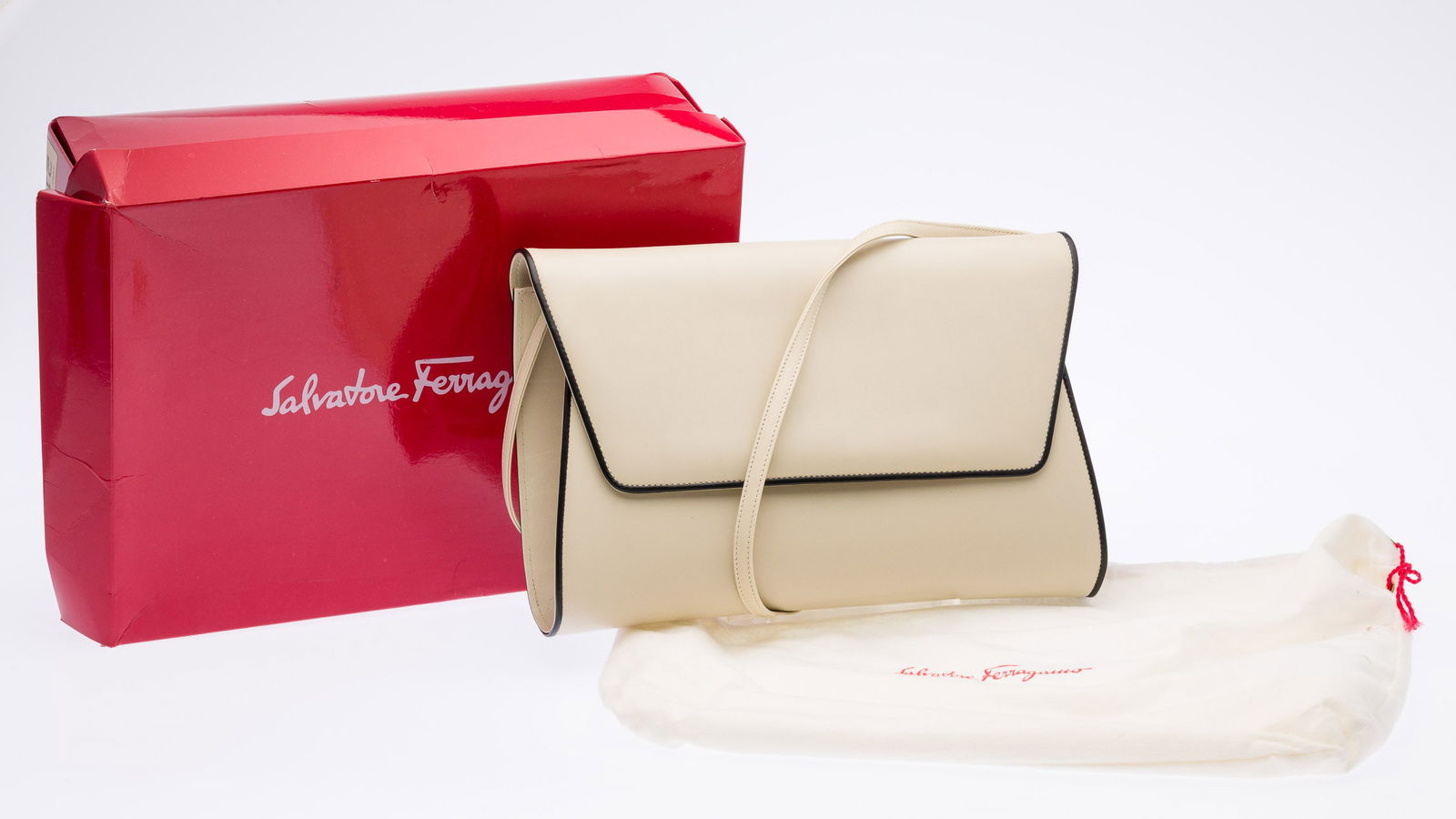 Ferragamo Leather Handbag: Description: Ferragamo Leather Handbag, warm gray leather with black trim, the front flap with magnetic clasp, opening to dark brown leather interior with zipper pocket with 'Salvatore Ferragamo,