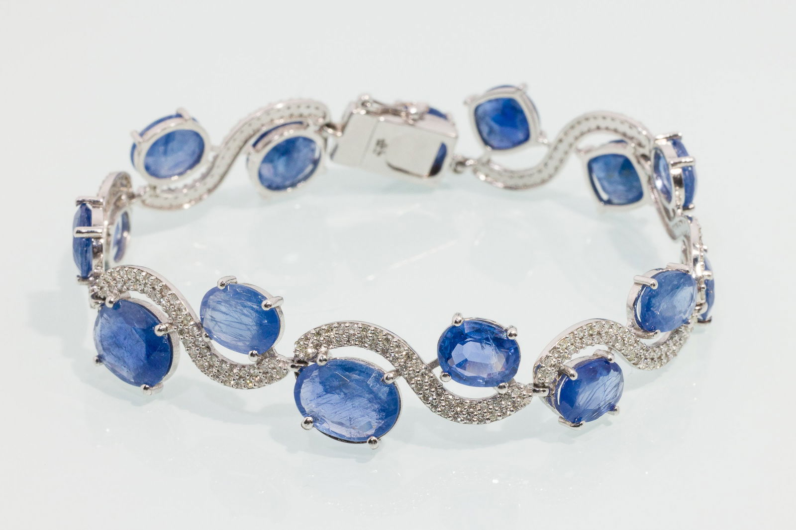 Sapphire, Diamond & Platinum Bracelet, with GIA Cert: Description: Sapphire, Diamond and Platinum Bracelet, with GIA Cert, platinum bracelet featuring various round and oval cut sapphires (approx. 26.03 cts, no indications of heating) and pave set small