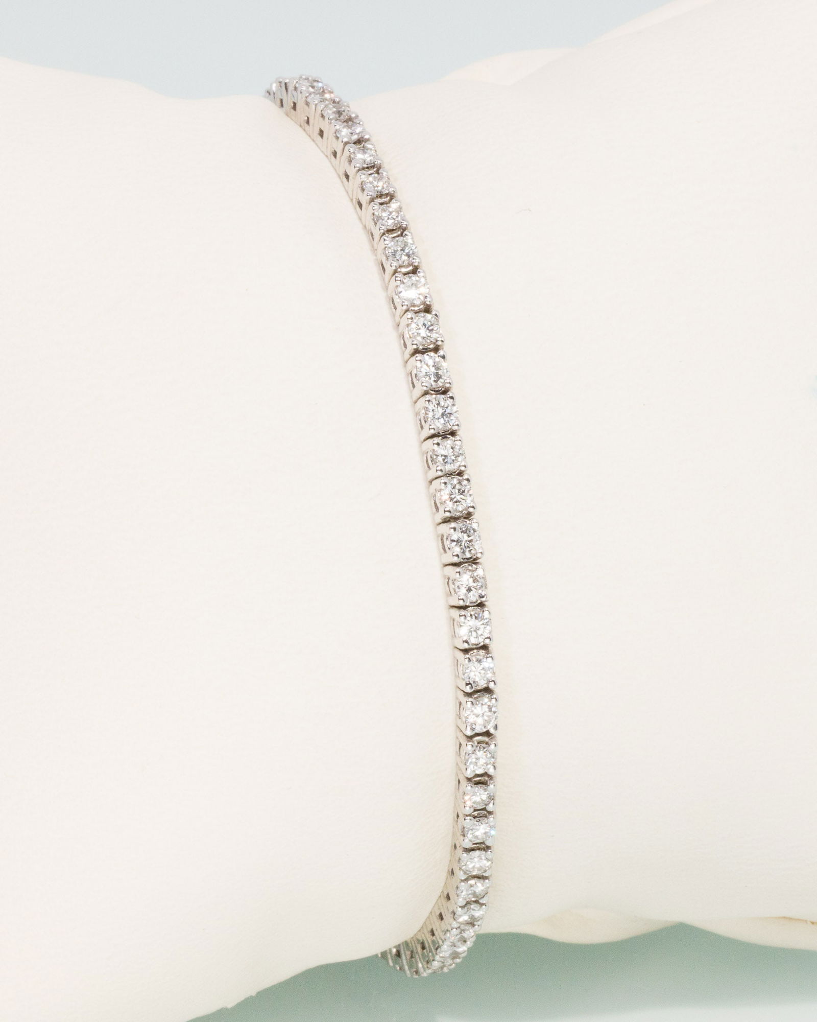 14K Gold and Diamond Tennis Bracelet: Description: 14K Gold and Diamond Tennis Bracelet, 14K white gold bracelet featuring approx. 3.5 cts of round diamonds (F-G, VS), with box clasp, marked '14K, 2.25' on back of clasp. 10.95