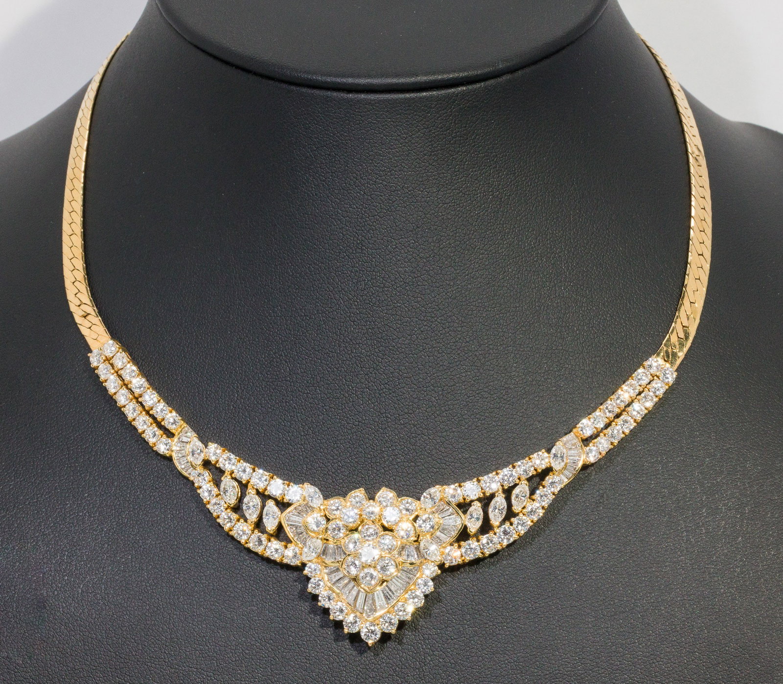 18K Gold and Diamond Necklace: Description: 18K Gold and Diamond Necklace, 18K yellow gold necklace with flat link chain, featuring various round, baguette and lozenge cut diamonds (approx. I7 cts, VS, G-H), with hidden pendant