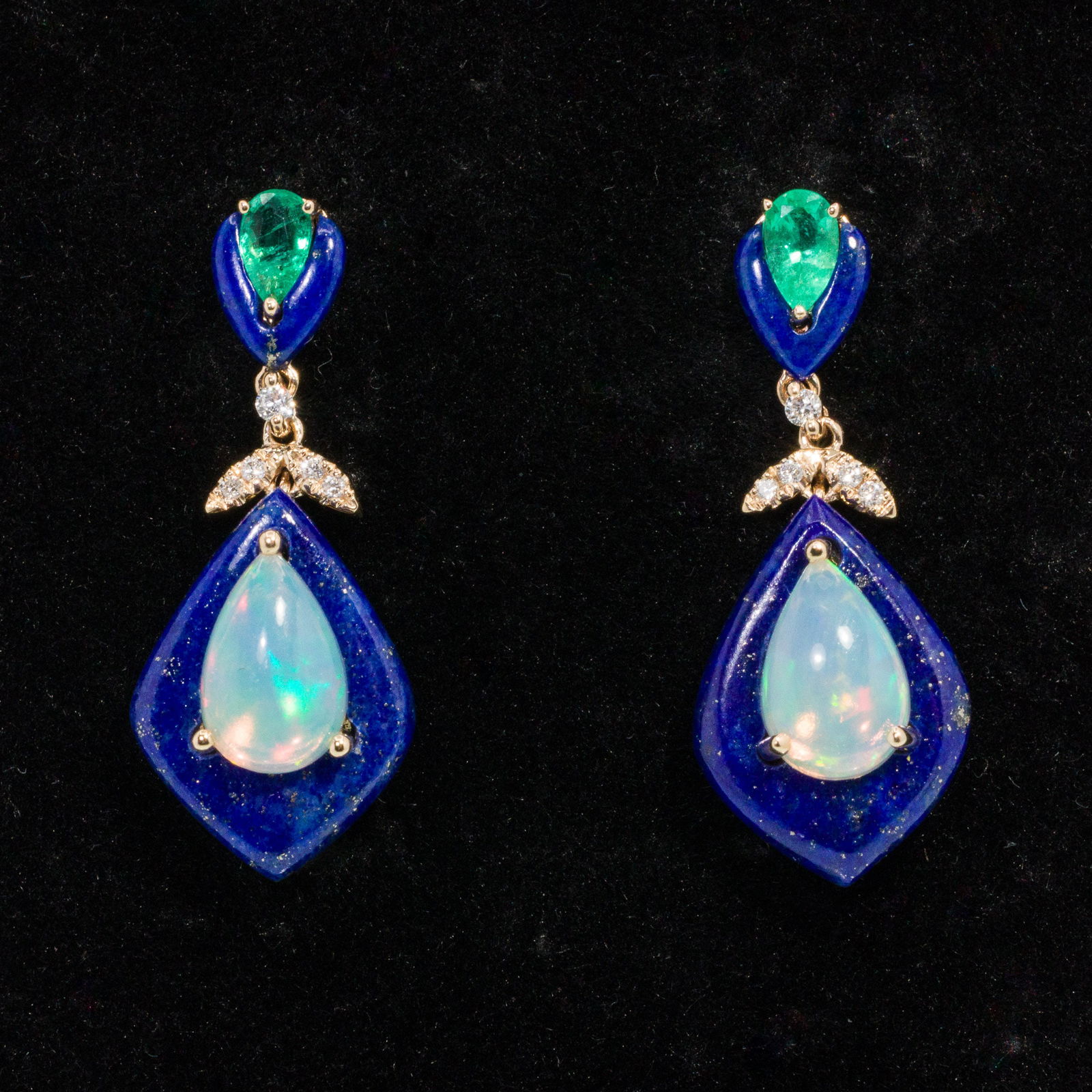 14K Ethiopian Opal, Lapis and Diamond Earrings: Description: 14K Ethiopian Opal, Lapis and Diamond Earrings, 14K yellow gold drop earrings featuring pear cut Ethiopian opals (approx. 1.62 cts total) on lapis surrounds with pear cut emeralds on