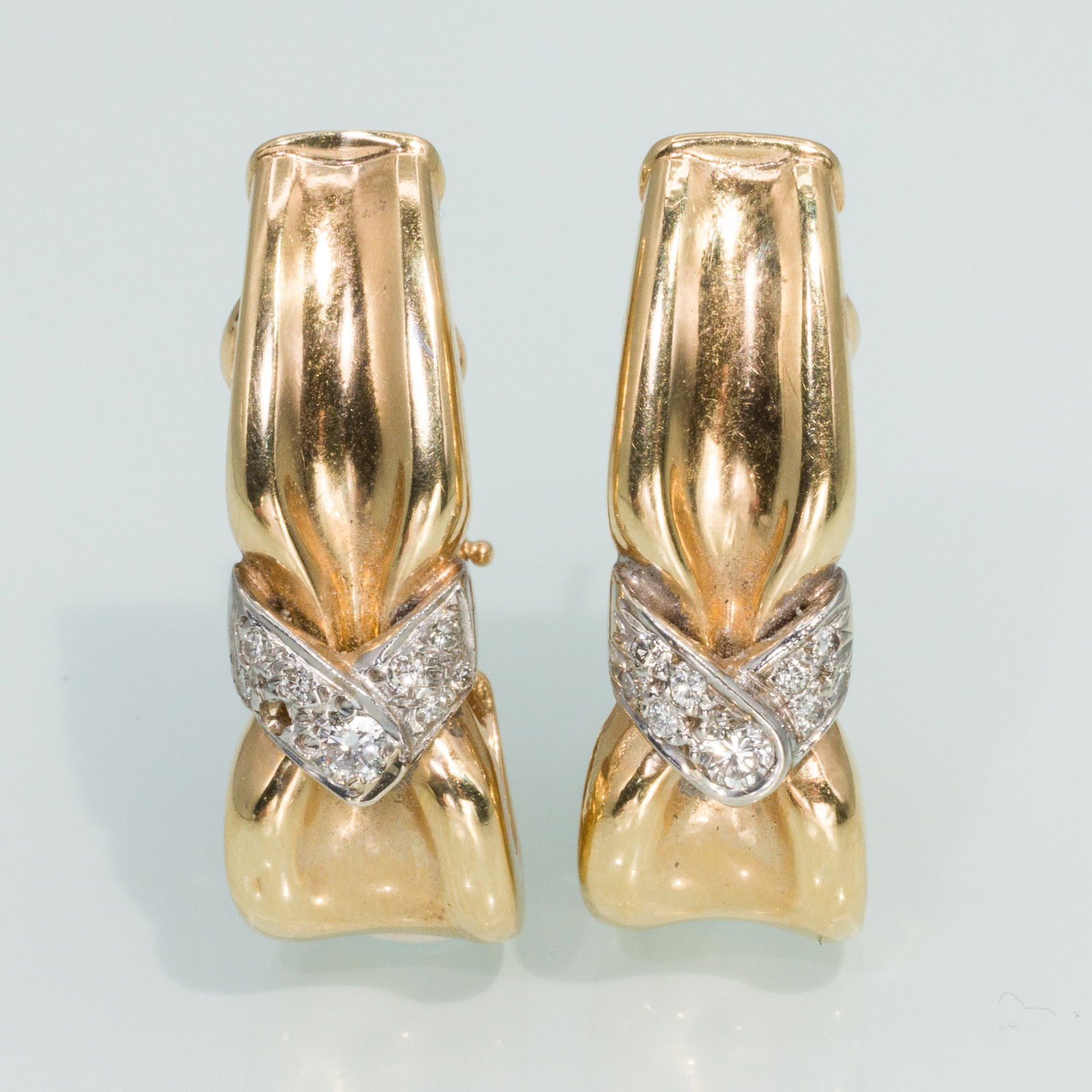 14K Gold and Diamond Earrings: Description: 14K Gold and Diamond Earrings, 14K yellow and white gold long hoop earrings set with round cut diamonds (approx. 0.25cts total), with clip and post backs, marked '14K' on clips. 11.46