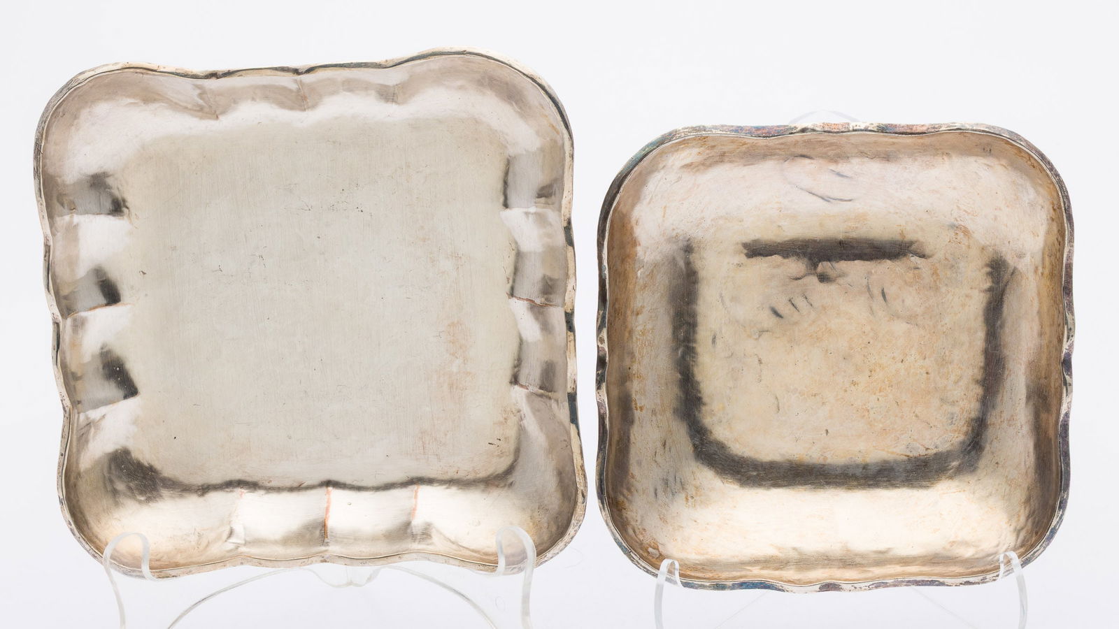 2 Peruvian Sterling Silver Hand-Hammered Bowls: Property from a Private Collection, Savannah, GADescription: Two Peruvian Sterling Silver Hand-Hammered Square Serving Bowls, each marked 'Peru Welsch E Sterling Amano'. 25.79 troy
