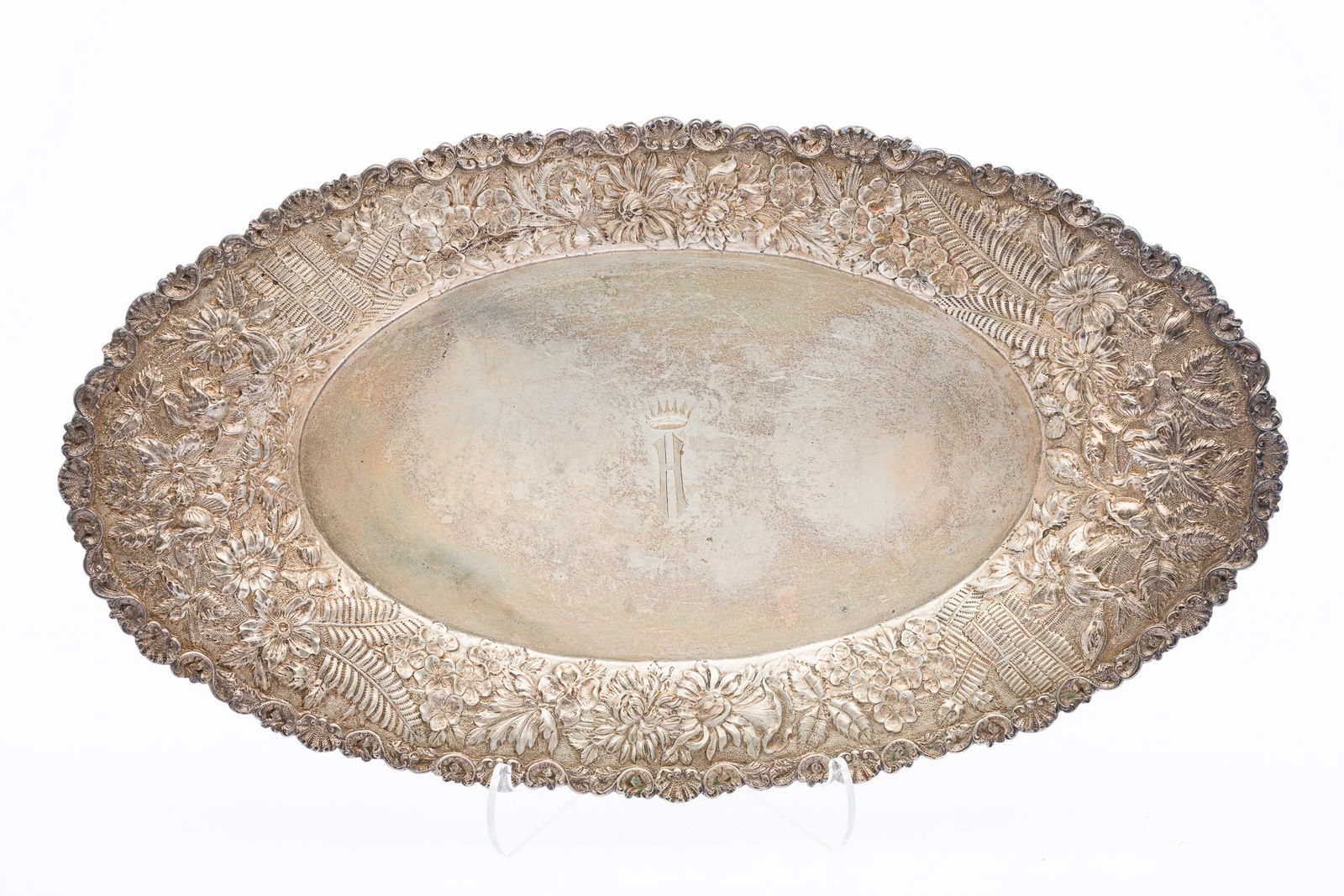 S. Kirk & Son Sterling Silver Oval Repoussé Platter: Property from a Private Collection, Savannah, GADescription: S. Kirk & Son Sterling Silver Oval Repoussé Platter, with H monogram with crown and floral repousse edge, marked 'S. Kirk & Son Co,