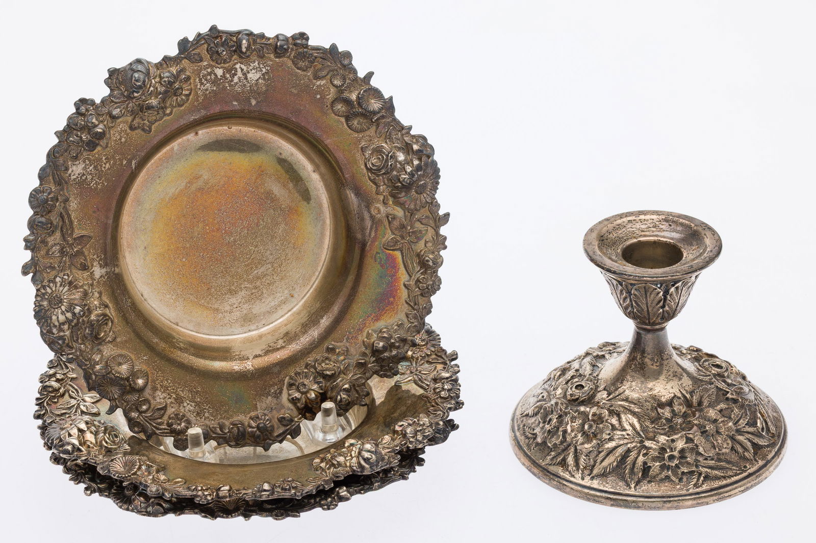 3 Repousse Wine Coasters and a Kirk Candlestick: Property from a Private Collection, Savannah, GADescription: 3 Repousse Wine Coasters and a Kirk Candlestick, comprising 3 wine coasters marked 'The Bailey Banks & Biddle Company, 925/1000 and a