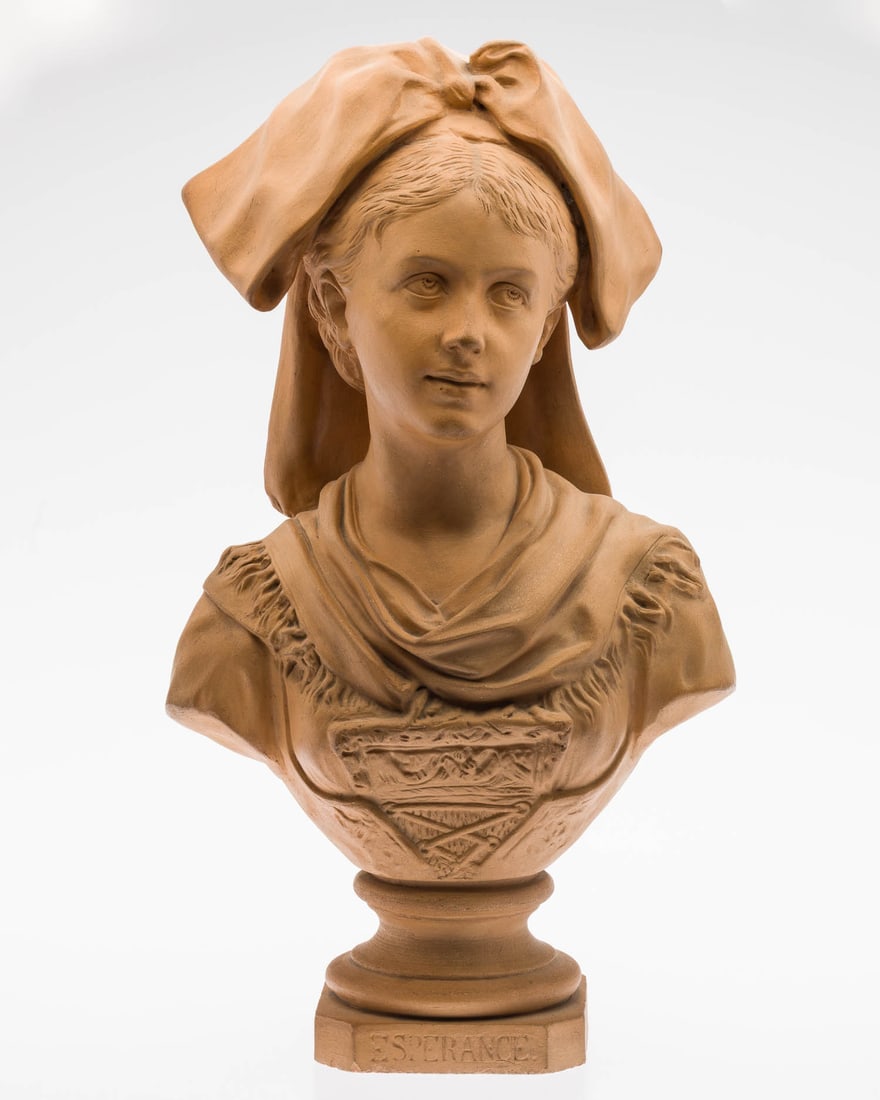 Terracotta Bust of ?Esperance: Property of Bliss Hebert and Allen Charles Klein Description: Terracotta Bust of ?Esperance?, depicting a young woman wearing a traditional headscarf, inscribed "Esperance" on a base. Measurements: