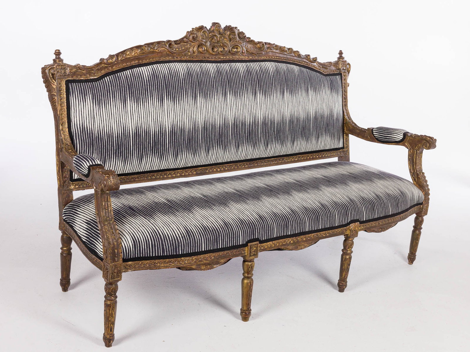 Continental Giltwood Settee with Robert Allen Fabric: Property of a Private Collector, St. Helena Island, SC Description: Continental Giltwood Settee with Robert Allen Fabric, with carved crest above an upholstered back and seat flanked by open arms
