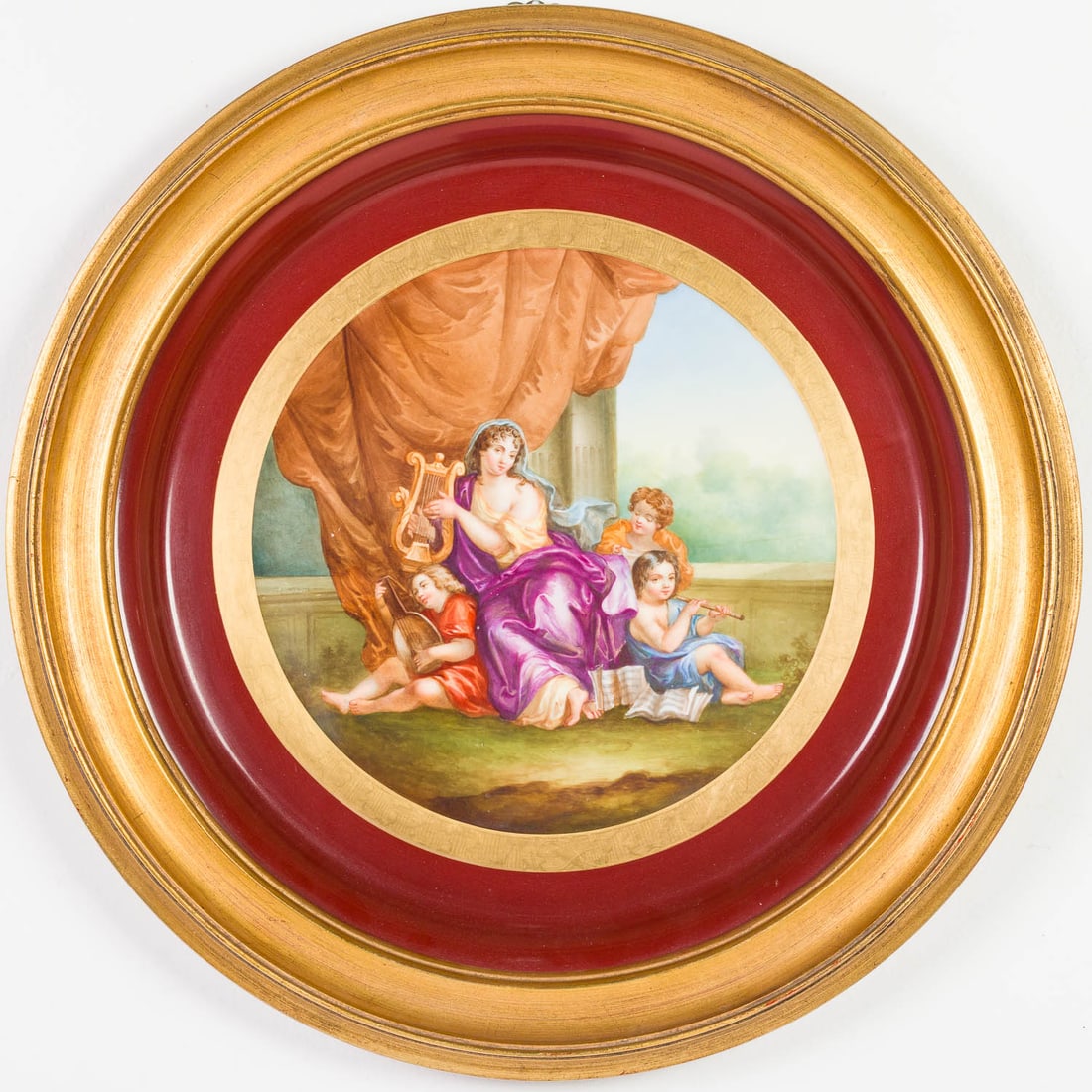 European Painted Porcelain Charger, 19th Century: Property from a Private Collection, New York City Description: European Painted Porcelain Charger, 19th Century, depicting reclining women with putti with musical instruments, in a giltwood frame.