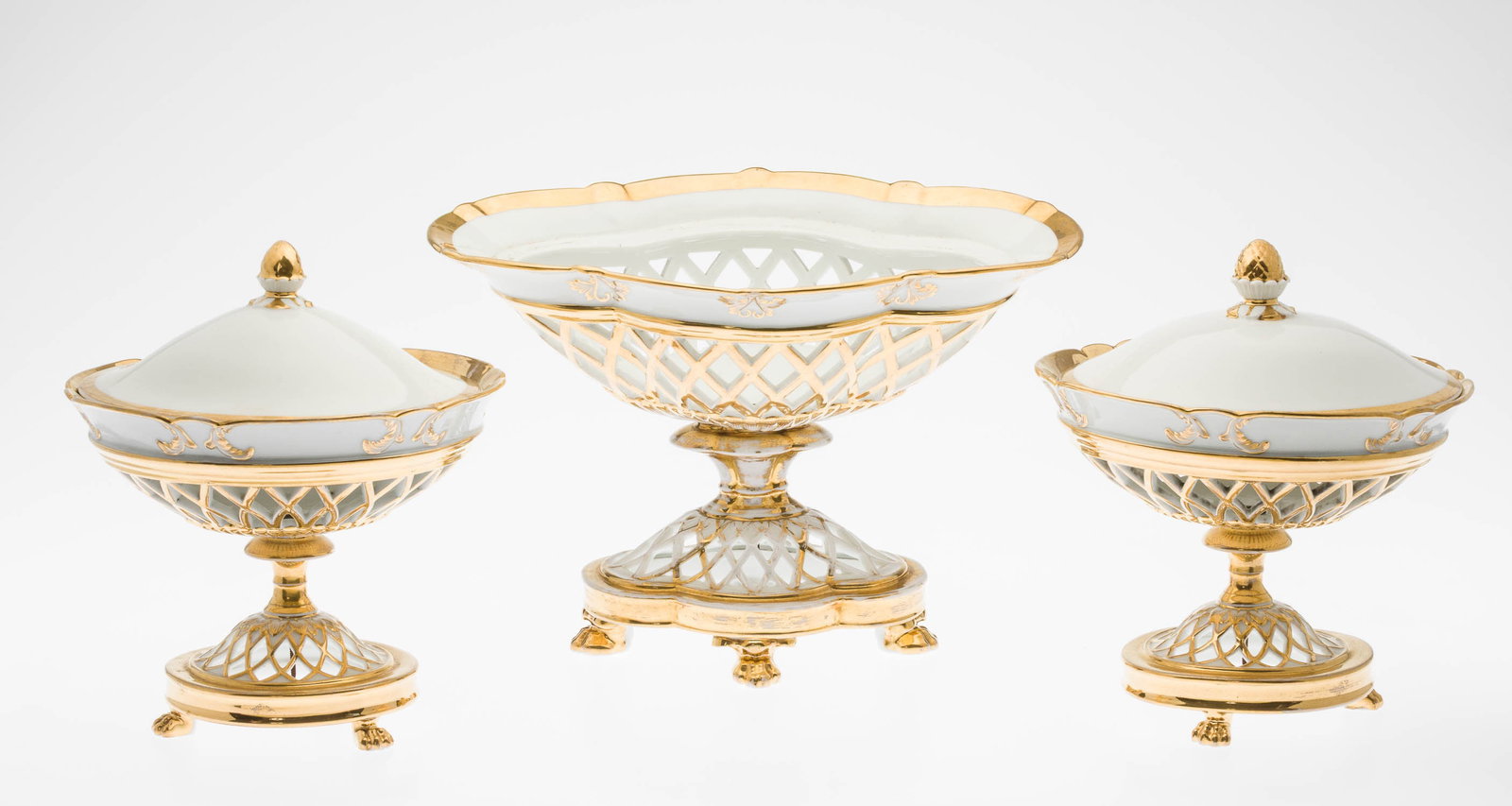Pair Paris Porcelain Compotes & Centerpiece, 19th C: Property from a Private Collection, New York City Description: Pair of Paris Porcelain Lidded Compotes and a Centerpiece, 19th C, comprising a pierced footed centerpiece basket with a pair of