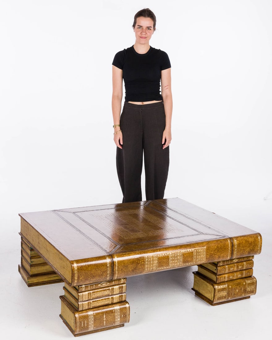 Maitland-Smith Book-Form Coffee Table: Description: Maitland-Smith Book-Form Coffee Table, the large book with drawer along the bound edge with Mailtand Smith label, raised on stacks of books, the front with two drawers each.
