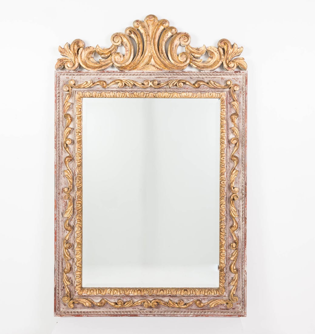 San Miguel Trading Co Carved Wood Mirror, 20th C: Property of a Private Collector, St. Helena Island, SC Description: San Miguel Trading Company Carved Wood Mirror, 20th Century, the rectangular mirror plate surmounted by a C-scroll carved gilt
