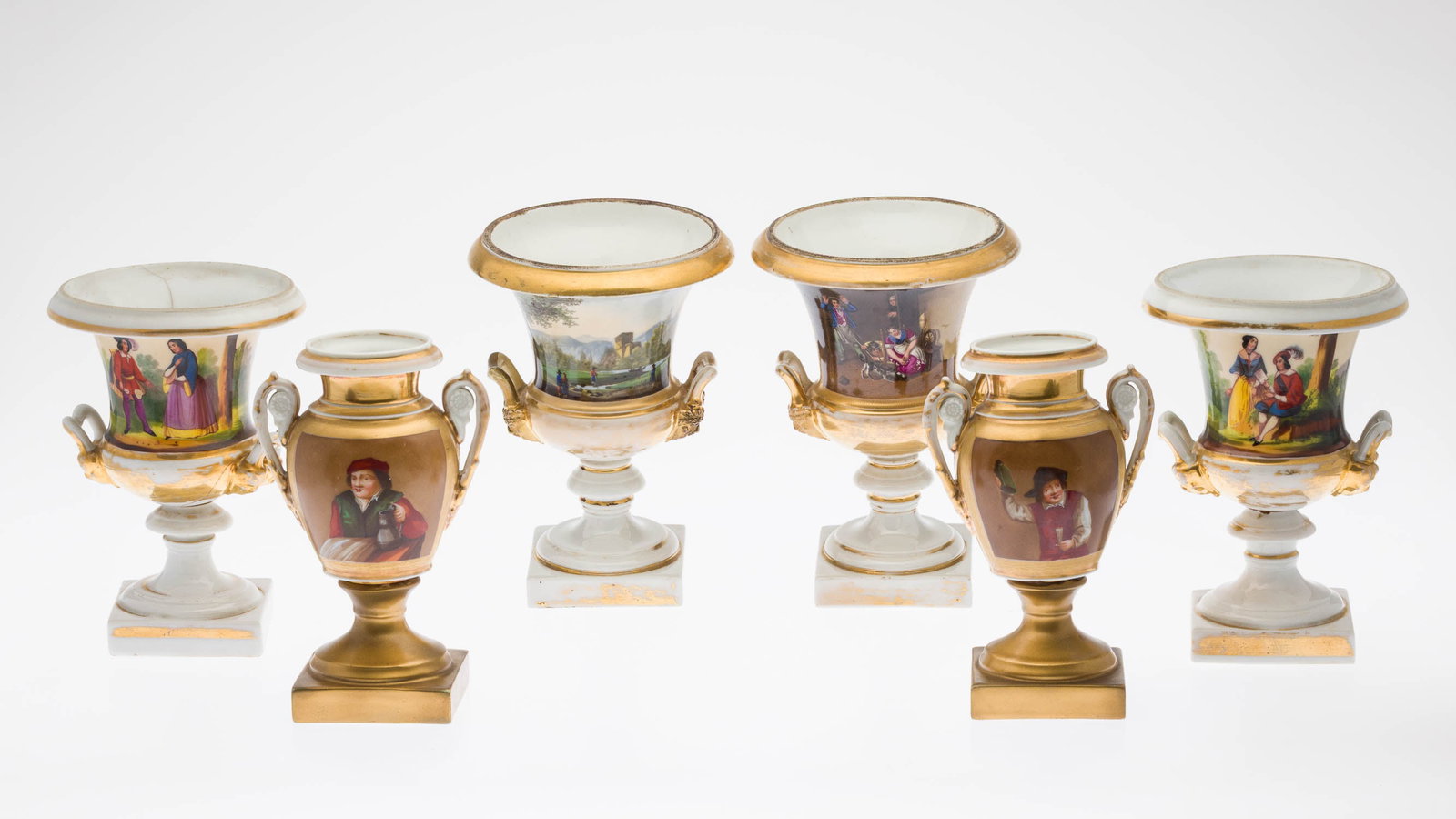 Three Pairs of Paris Porcelain Urns: Property from a Private Collection, New York City Description: Three Pairs of Paris Porcelain Urns, comprising a pair of 8 1/4 in. urns decorated with tavern figures (rubbing and losses to gilt,