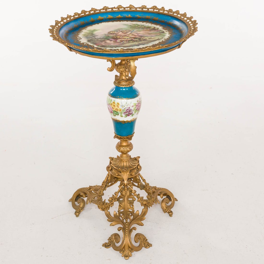 Louis XVI Style Gilt Metal Side Table, Late 19th C: Property from a Private Collection, New York City Description: Louis XVI Style Gilt Metal Circular Side Table, Late 19th Century, inset with central porcelain plate with pierced metal edge, on a