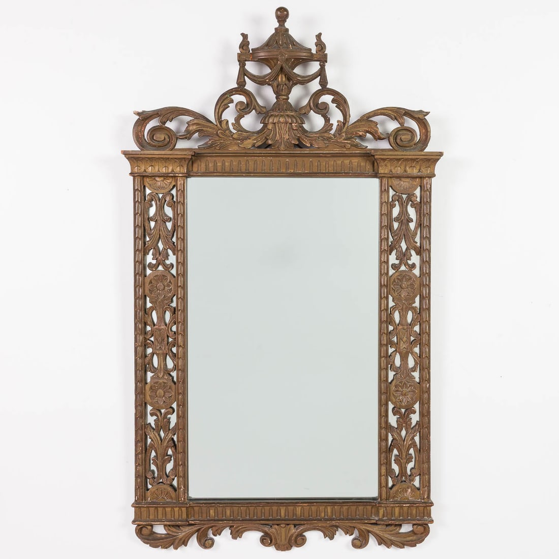 Italian Neoclassical Style Mirror, 20th C: Property from a Private Collection, Ponte Vedra, FL Description: Italian Neoclassical Style Mirror, 20th C, the rectangular mirror plate with pierced mirrored sides surmounted by an urn.