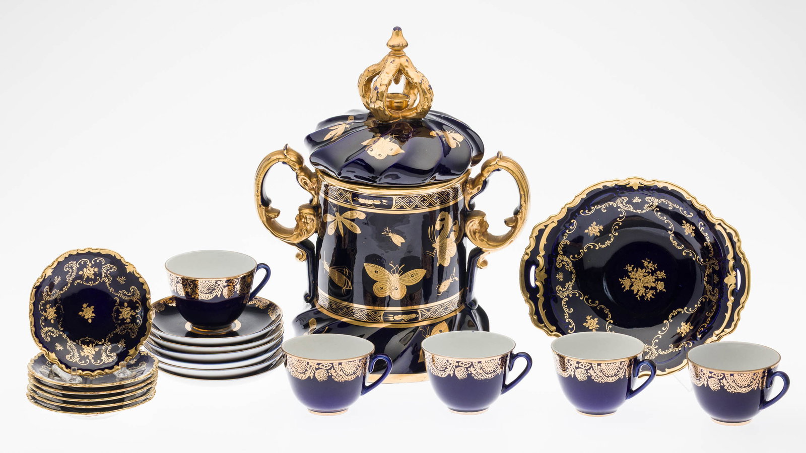 Masons Ironstone Centerpiece & Russian Cups & Saucer: Property from a Private Collection, New York City Description: Masons Ironstone Lidded Centerpiece with Set of Russian Cobalt Blue Cups and Saucers, comprising 5 Russian porcelain teacups (one with