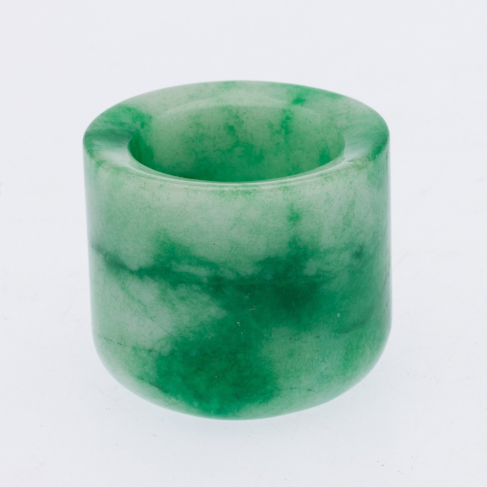 Chinese Jadeite Archer's Ring: Property from the Estate of Arthur B. Kouwenhoven Jr., Savannah, GA Description: Chinese Jadeite Archer's Ring, in green and white jadeite. Measurements: Height: 1 in. x Width: