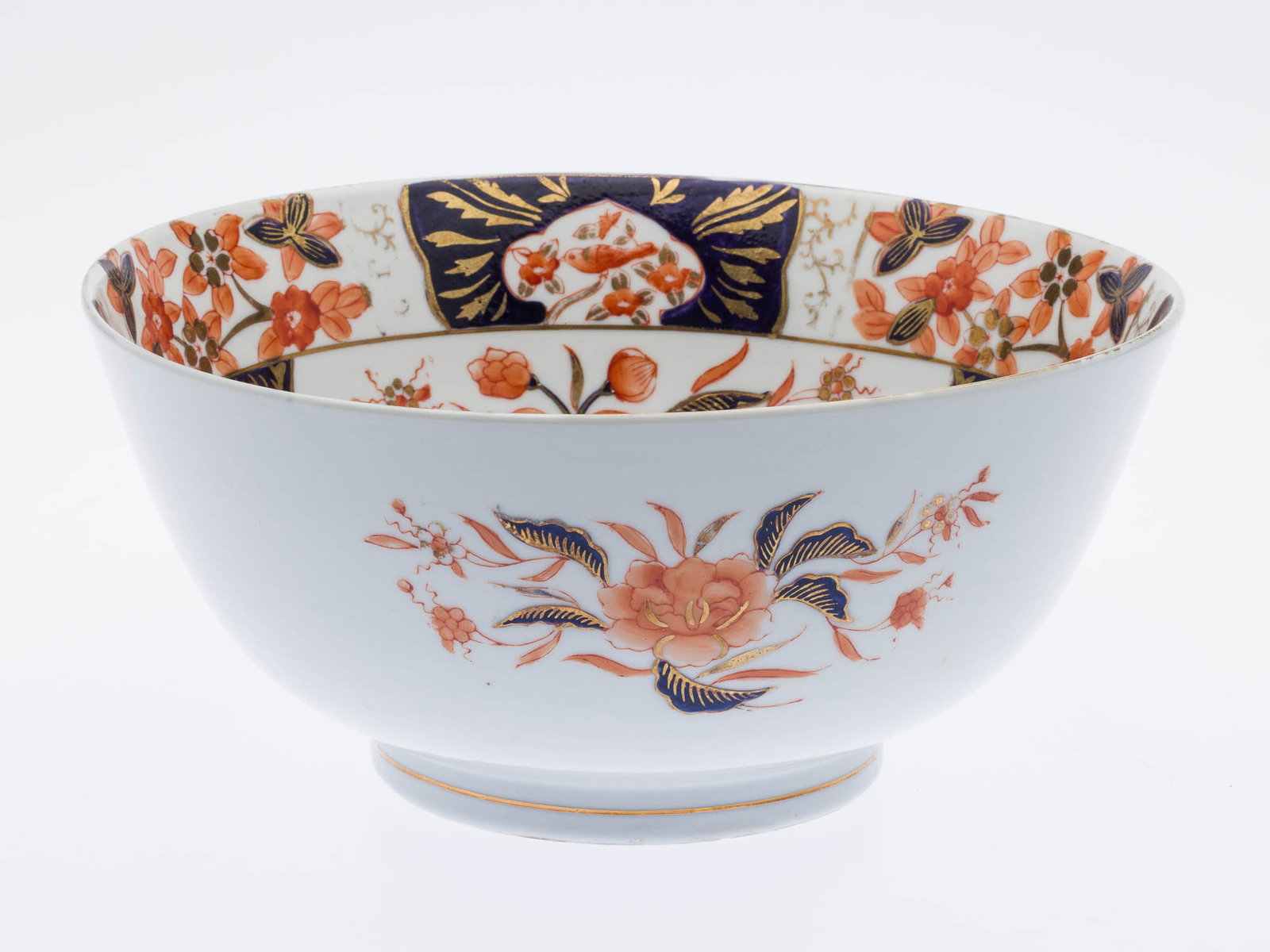 Porcelain Imari Style Vase and Bowl, 19th Century: Property from the Sandra S. Rhodes Estate, Hilton Head Island, SC Description: Porcelain Imari Style Vase and Bowl, 19th Century, unmarked, decorated with blue, orange and gilt flowers and birds.<