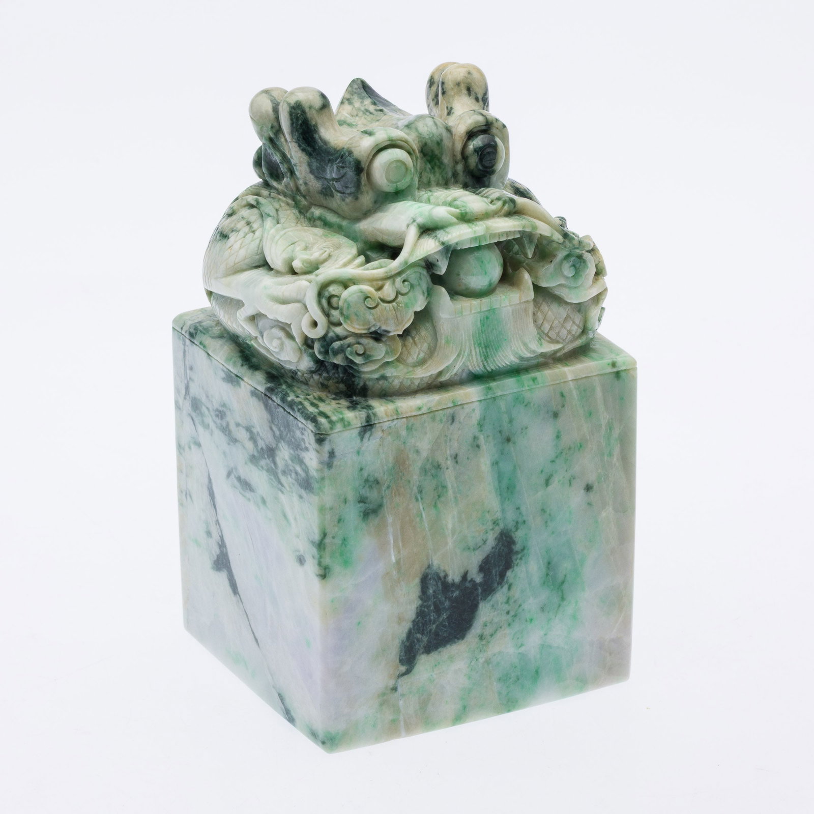 Chinese Carved Jadeite Stamp with Dragon Head: Property from the Estate of Arthur B. Kouwenhoven Jr., Savannah, GA Description: Chinese Carved Jadeite Stamp with Dragon Head, square white and green jadeite stamp with carved dragon head.