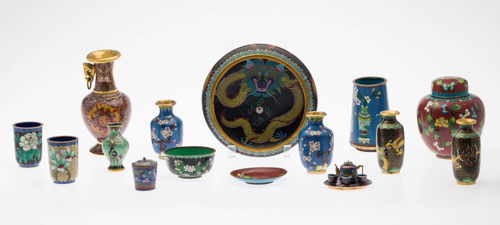 15 Asian Cloisonne Articles: Property of Bliss Hebert and Allen Charles Klein Description: 15 Asian Cloisonne Articles, comprising 9 vases, ginger jar, 2 bowls, small dish, lidded jar, miniature teapot with three cups and a t