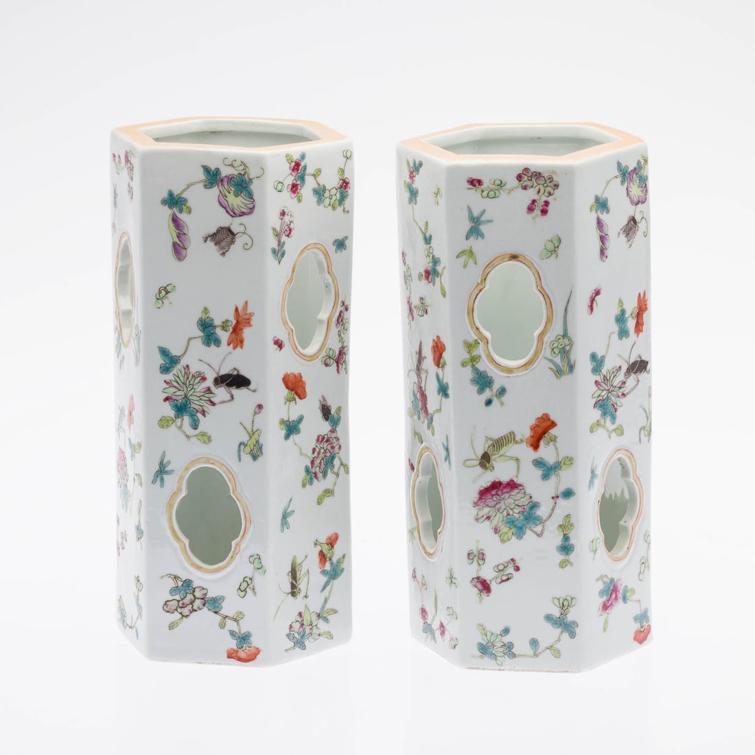 Pair of Chinese Porcelain Wig Stands, Modern: Property of a Private Collector, Savannah, GA Description: Pair of Chinese Porcelain Wig Stands, Modern, each decorated with flowering branches and insects, unmarked. Measurements: Height: 10 1/2 in.