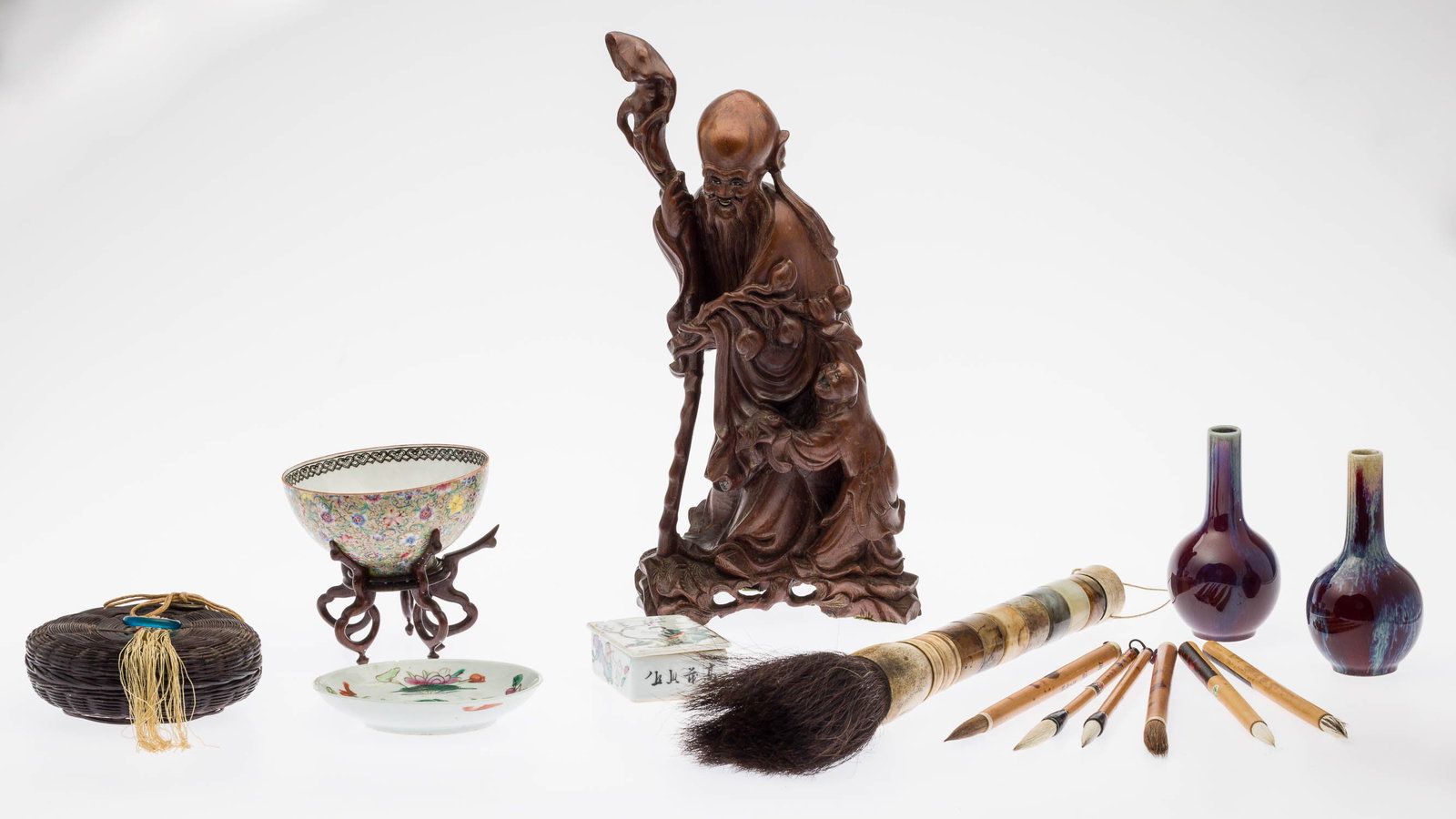 Group of 14 Chinese Articles: Property of Bliss Hebert and Allen Charles Klein Description: Group of 14 Chinese Articles, comprising a carved wood figure of a sage and boy, a pair of sang de boef small vases marked in blue on