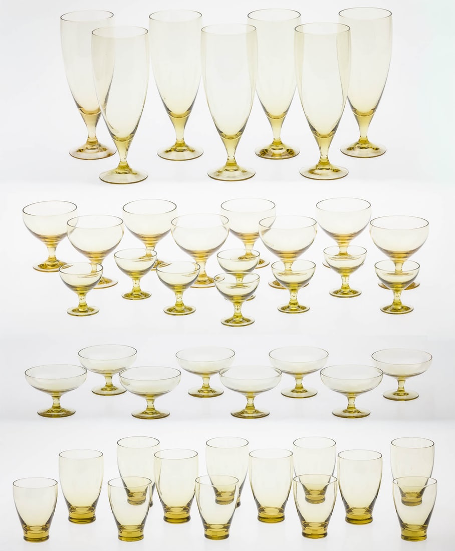 Russel Wright Morgantown Amber Glasses, 44 pcs.: Description: Russel Wright Morgantown Amber Glasses, 44 pcs., comprising 7 highballs (7 1/2 in.), 8 lowballs (4 1/2 in.; two chipped), 5 short lowballs (3 1/2 in.), 8 cordials (3 1/8 in.; one with