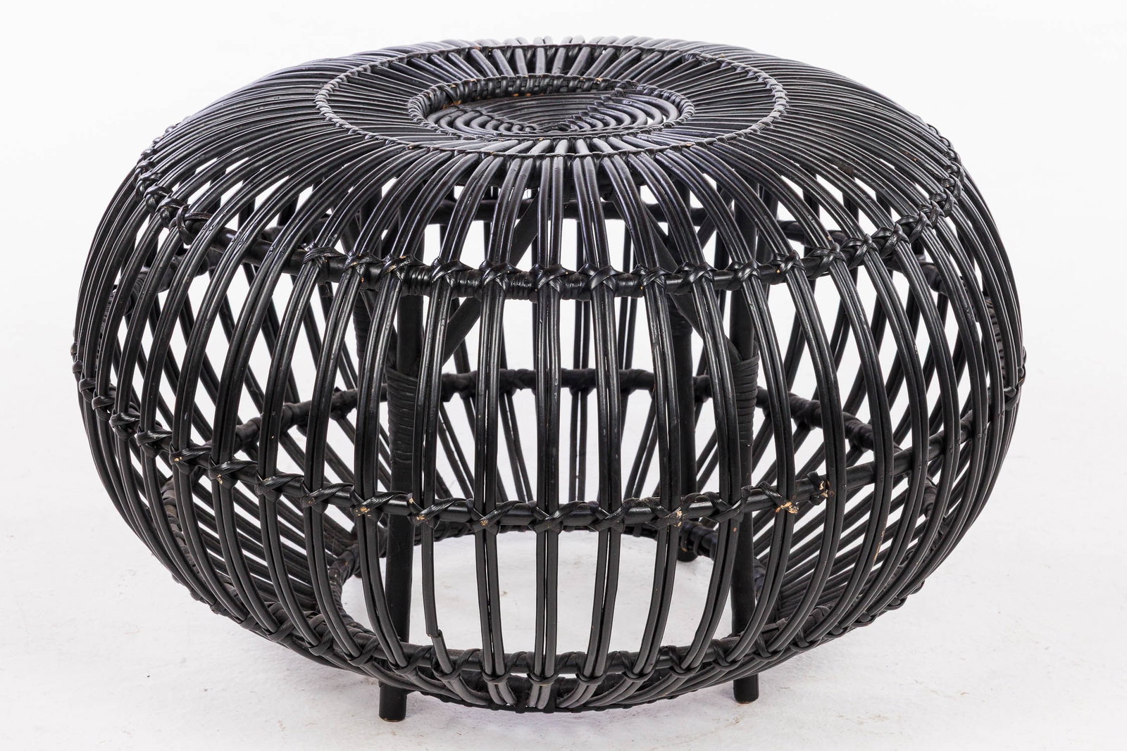 Franco Albini Black Ottoman: Property of a Private Collector, St. Helena Island, SC Description: Franco Albini Black Ottoman, of circular characteristic form. Measurements: Height: 15 in. x Width: 24 in.