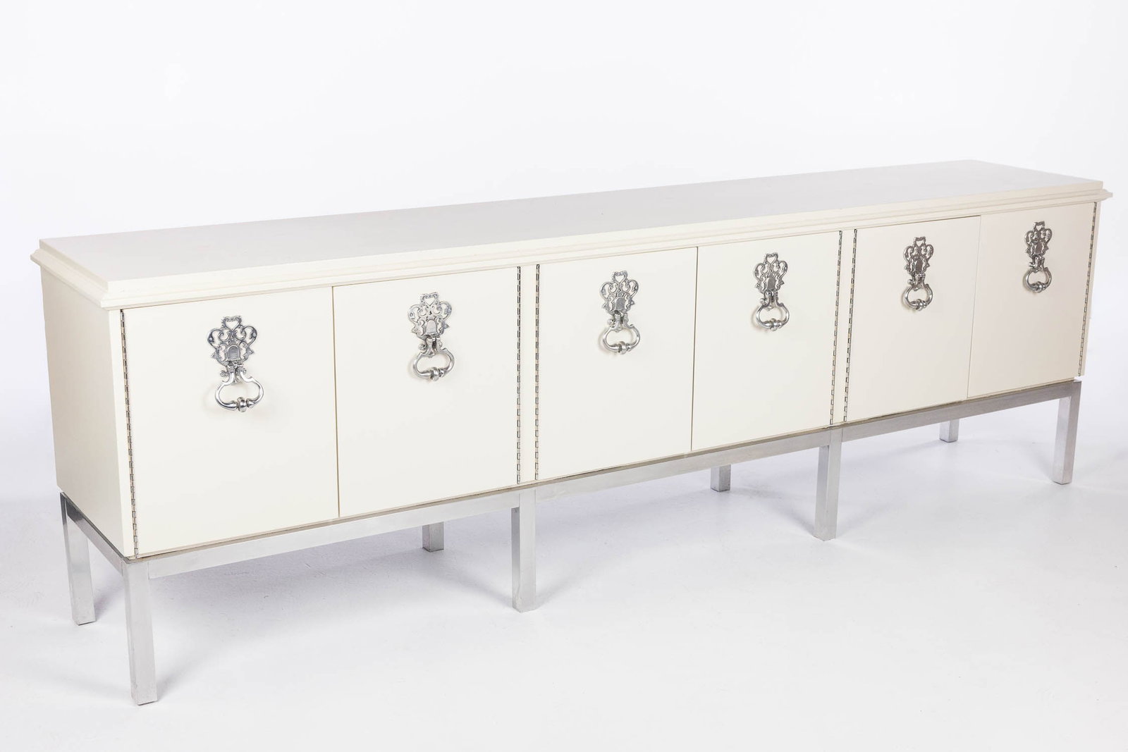 Vintage Mastercraft White Painted Side Cabinet: Property of a Private Collector, St. Helena Island, SC Description: Vintage Mastercraft White Painted Side Cabinet, the rectangular top over six cabinet doors, the two end cabinets opening to 3 dr
