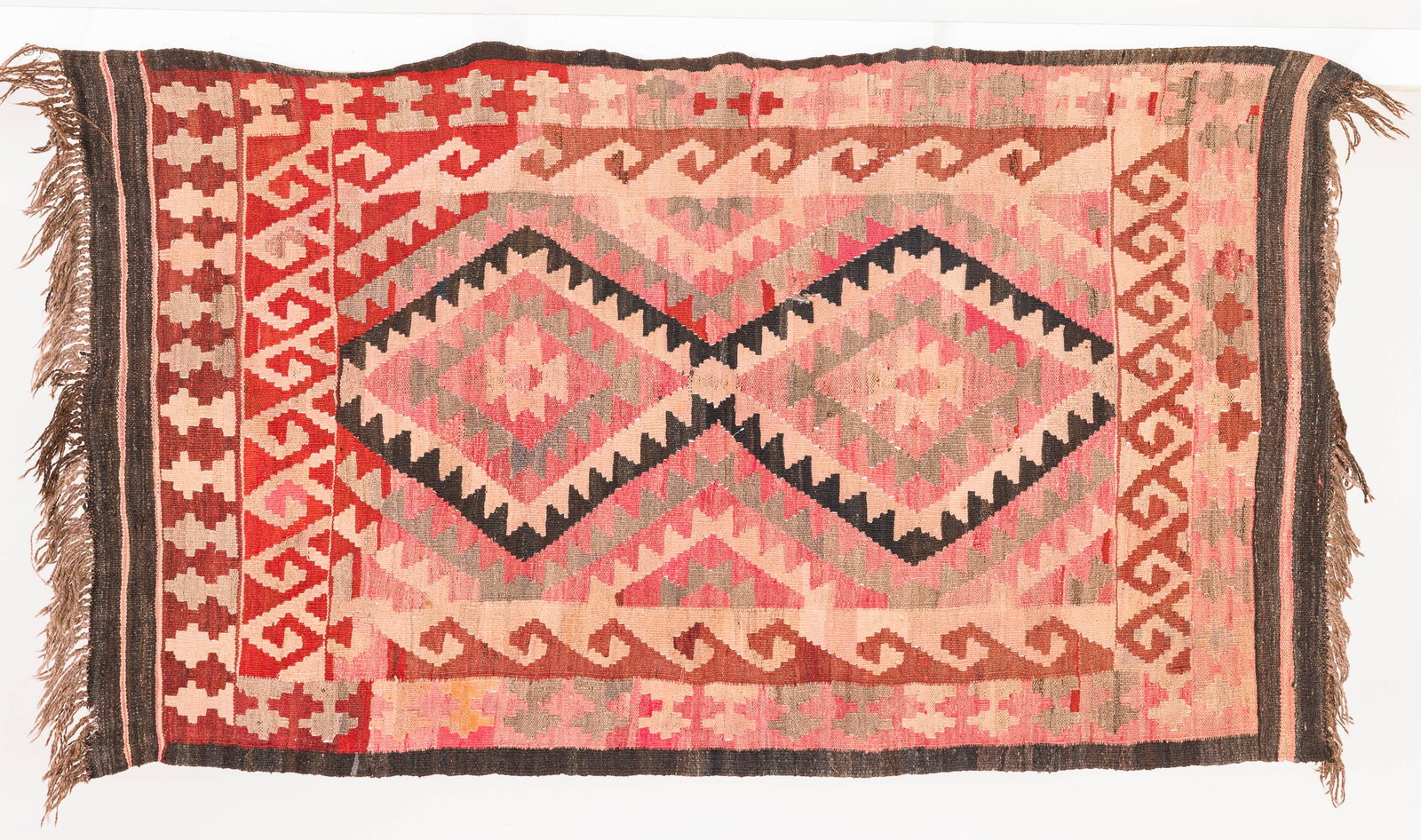 Kilim Wool Rug: Property of Bliss Hebert and Allen Charles Klein Description: Kilim Wool Rug, in tones of red and green with a geometric pattern. Measurements: Length: 71 in. x Width: 39,5 in.