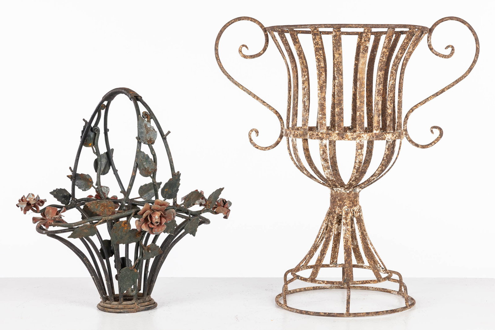 French Metal Planter and a Funerary Flower Basket: Description: French Metal Planter and a Funerary Flower Basket, comprising a French metal urn-form planter basket and a metal funerary flower basket with rose vines. Measurements: Height: of tallest