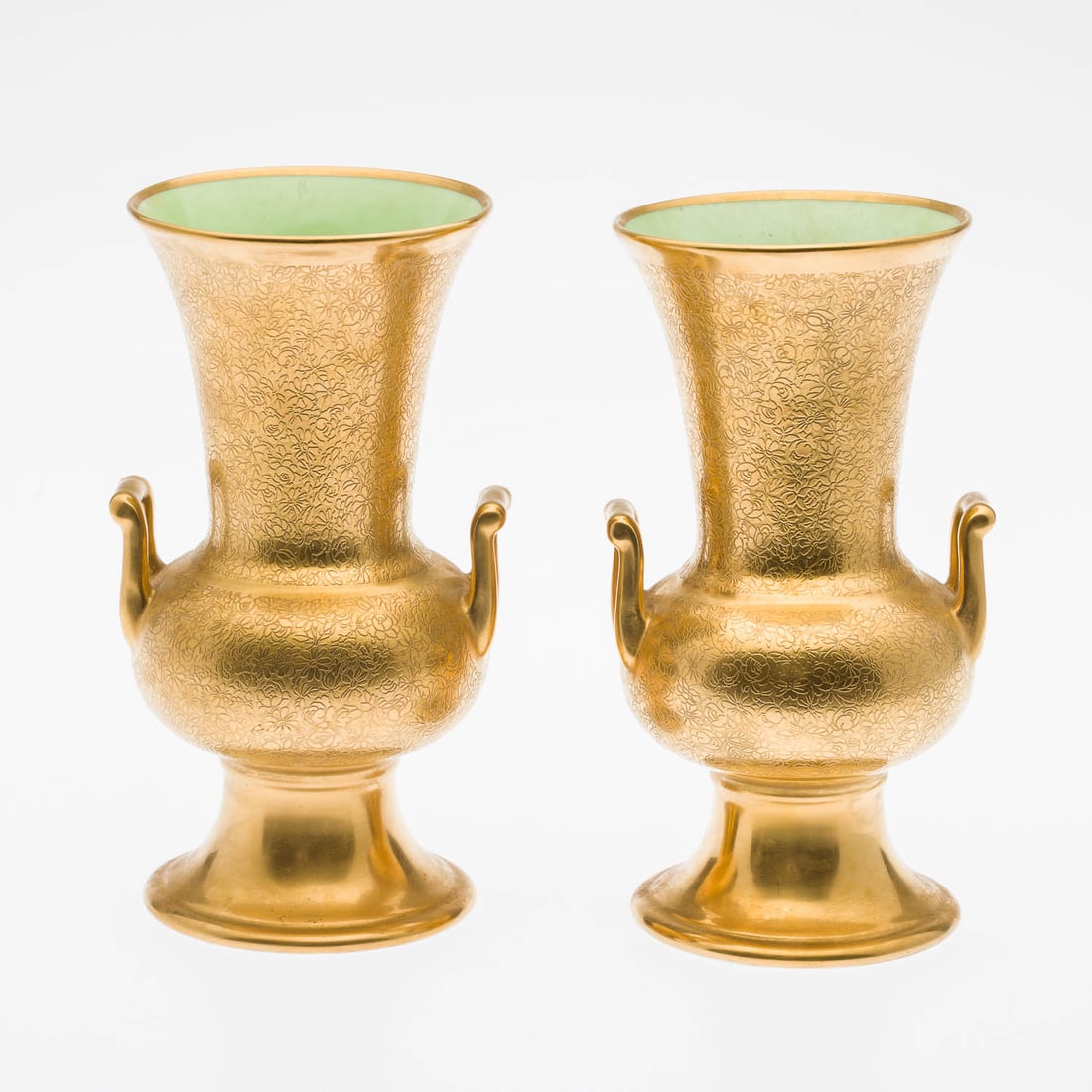 Pair of Pickard Gold Porcelain Urns: Property of a Private Collector, St. Helena Island, SC Description: Pair of Pickard Gold Porcelain Urns, each with embossed gilt exterior and pale green interior, marked in gold on bottom and